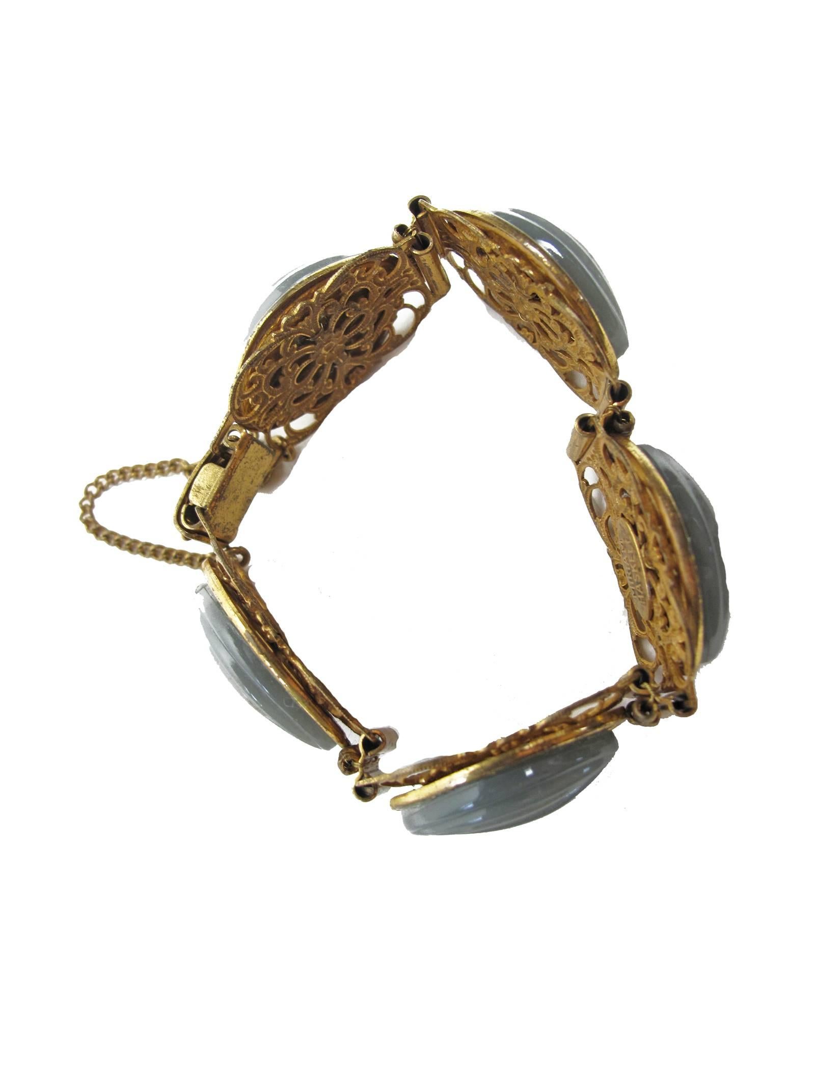 Miriam Haskell signed goldtone and grey oval link bracelet.  Condition: Very good.  3/4" H x 8 1/2" length. 

We accept returns for refund, please see our terms.  We offer free ground shipping within the US. Please let us know if you