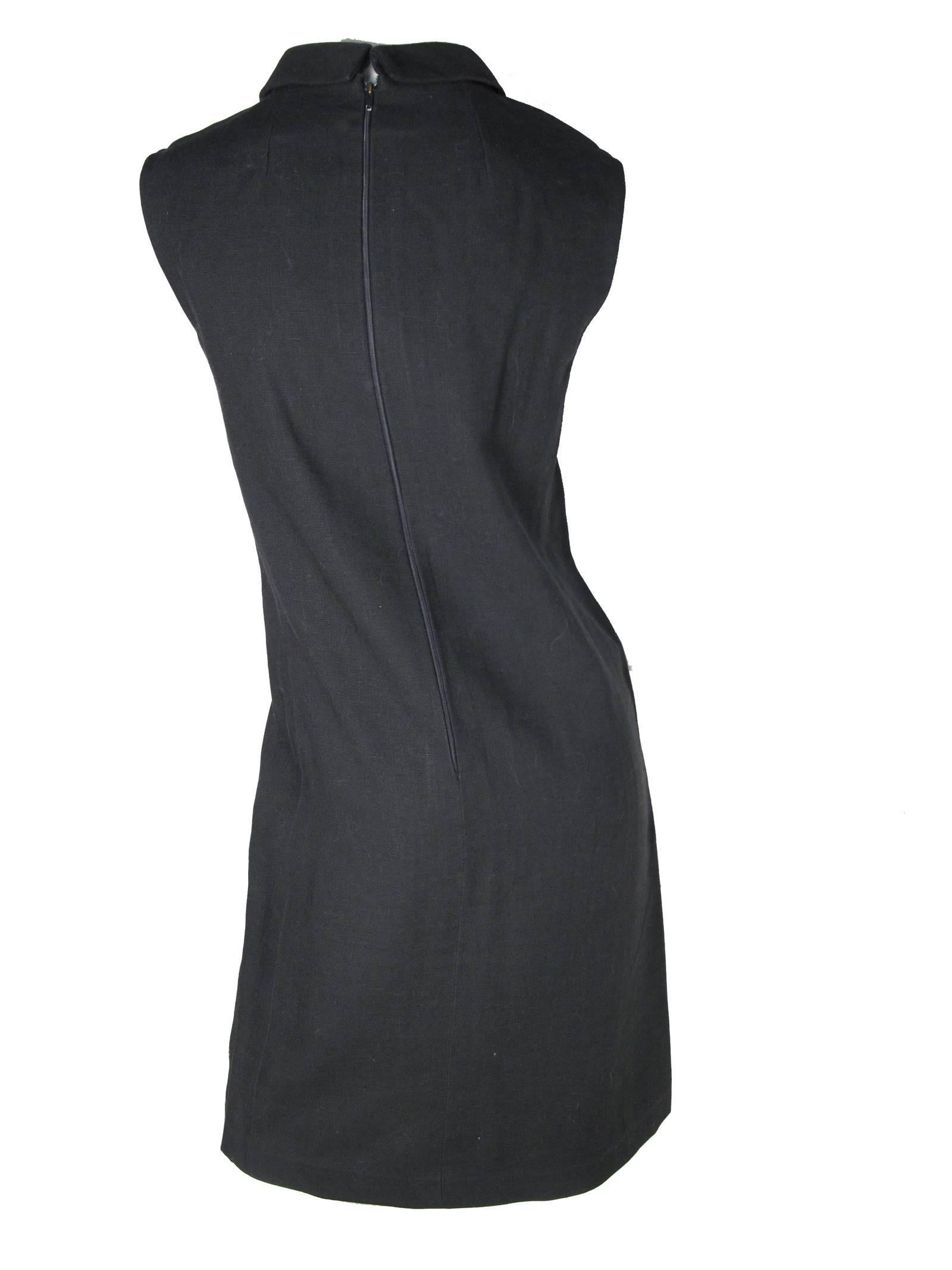 1960s Geoffrey Beene double breasted black linen dress with front pockets. Condition: Excellent. Size Med
34" bust, 33" waist, 36" hips, 39.5" length. 
We accept returns for refund, please see our terms.  We offer free ground