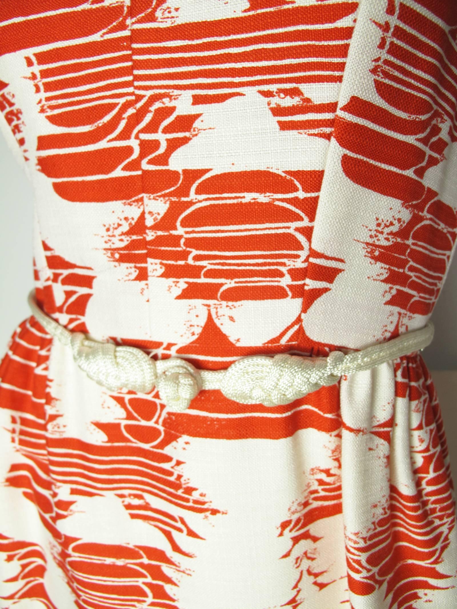 1960s Adele Simpson red and white linen dress with rope belt and side pockets, v neck, zipper at back. Condition: Excellent. Size Medium

We accept returns for refund, please see our terms.  We offer free ground shipping within the US.  Please let