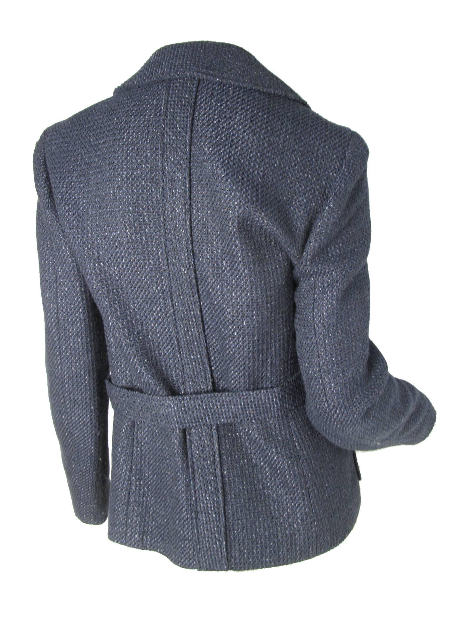 2001 Chanel navy jacket with belt and fabric woven to sparkle. Two front pockets.   Cotton, Acrylic, rayon, poly fabric. Silk lining.  Condition: Excellent. 
Size 40

38