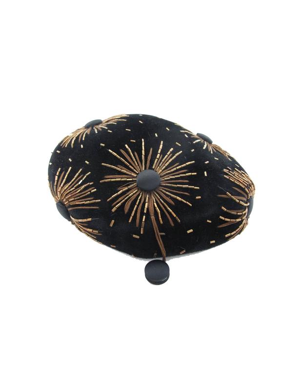 1950s black velvet beret with bronze bugle bead and bronze thread starbursts. Condition: Excellent. 