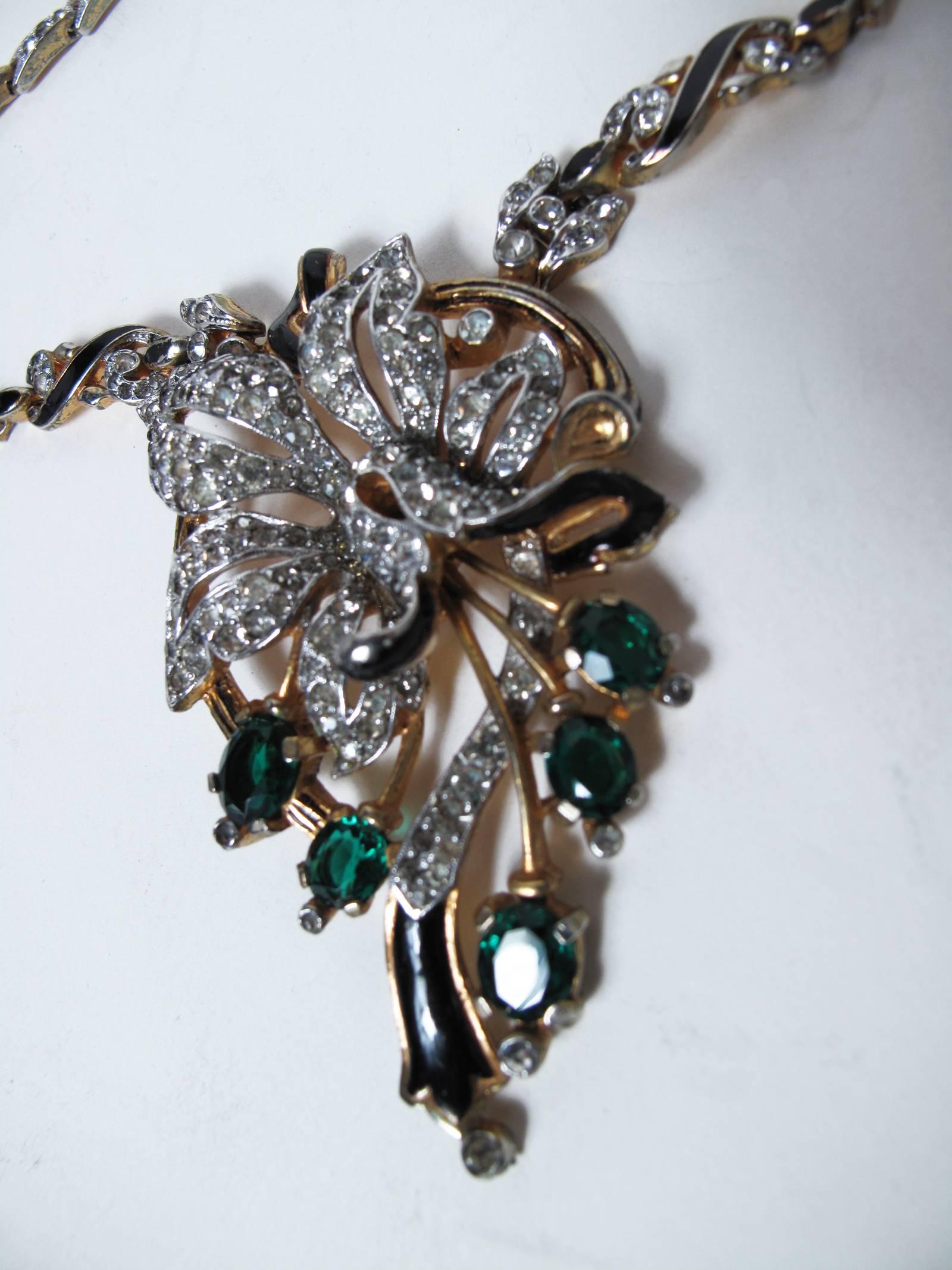 Trifari rhinestone and enamel necklace. Stamped Trifari. Condition: good, wear to goldstone, no stones missing.  Pendant: 3