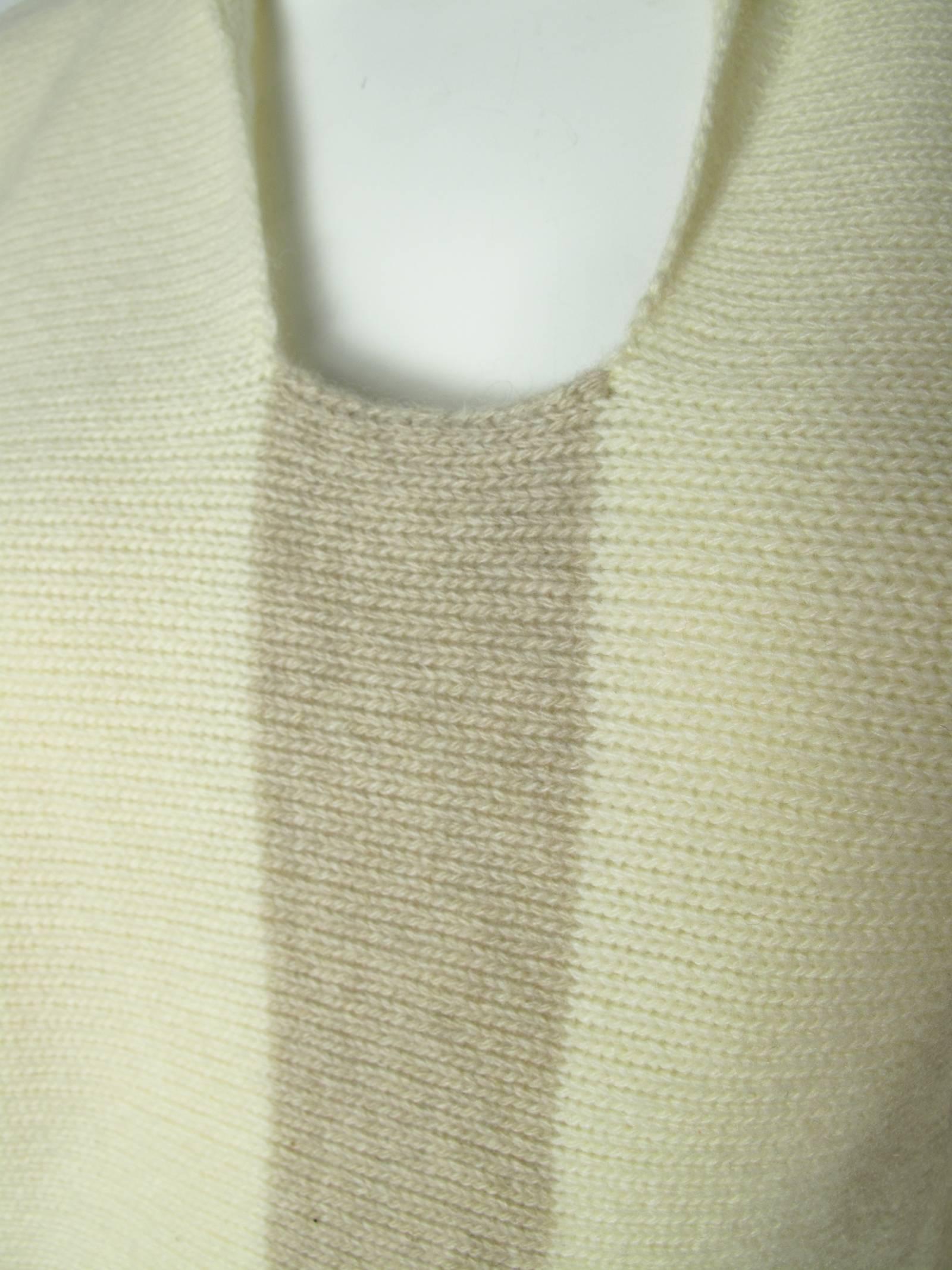 Chanel creme and beige cashmere sweater. Condition: Very good.  circa 1999. Size 40.  
We accept returns for refund, please see our terms.  We offer free ground shipping within the US.  Please let us know if you have any questions. 