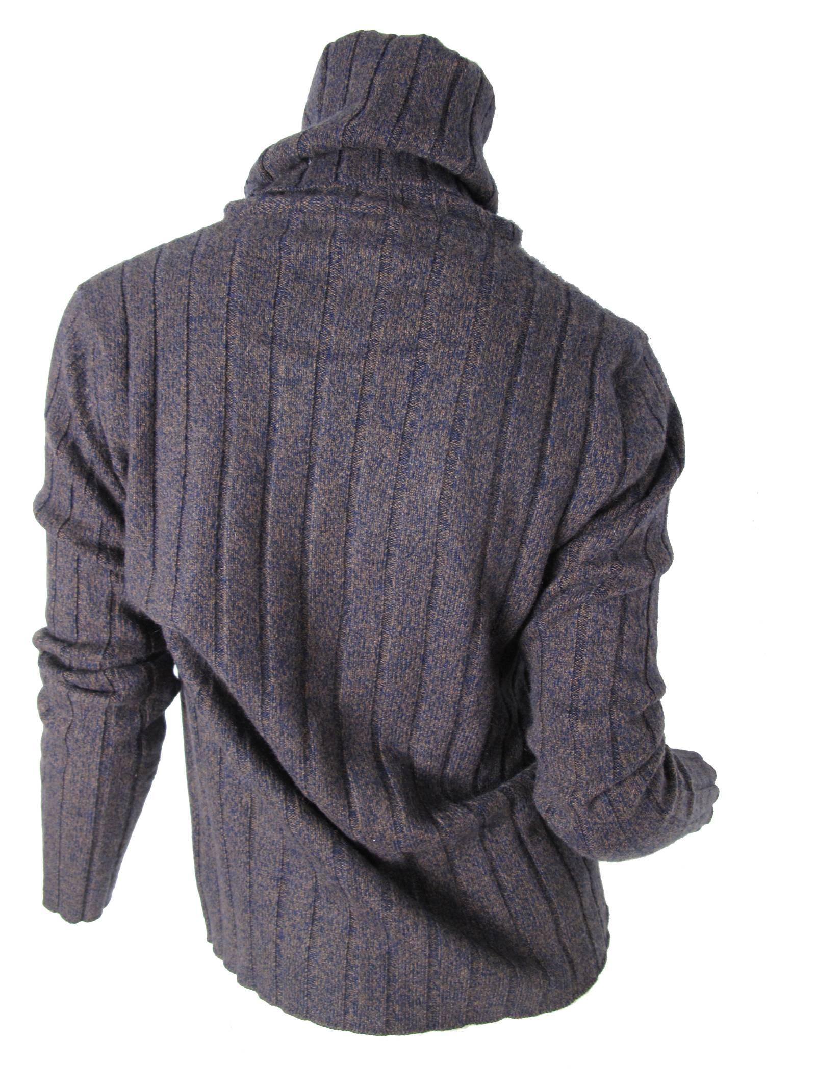 Chanel Brown and blue ribbed funnel neck sweater. Condition: Excellent. Size 40. 
We accept returns for refund, please see our terms.  We offer free ground shipping within the US.  Please let us know if you have any questions. 