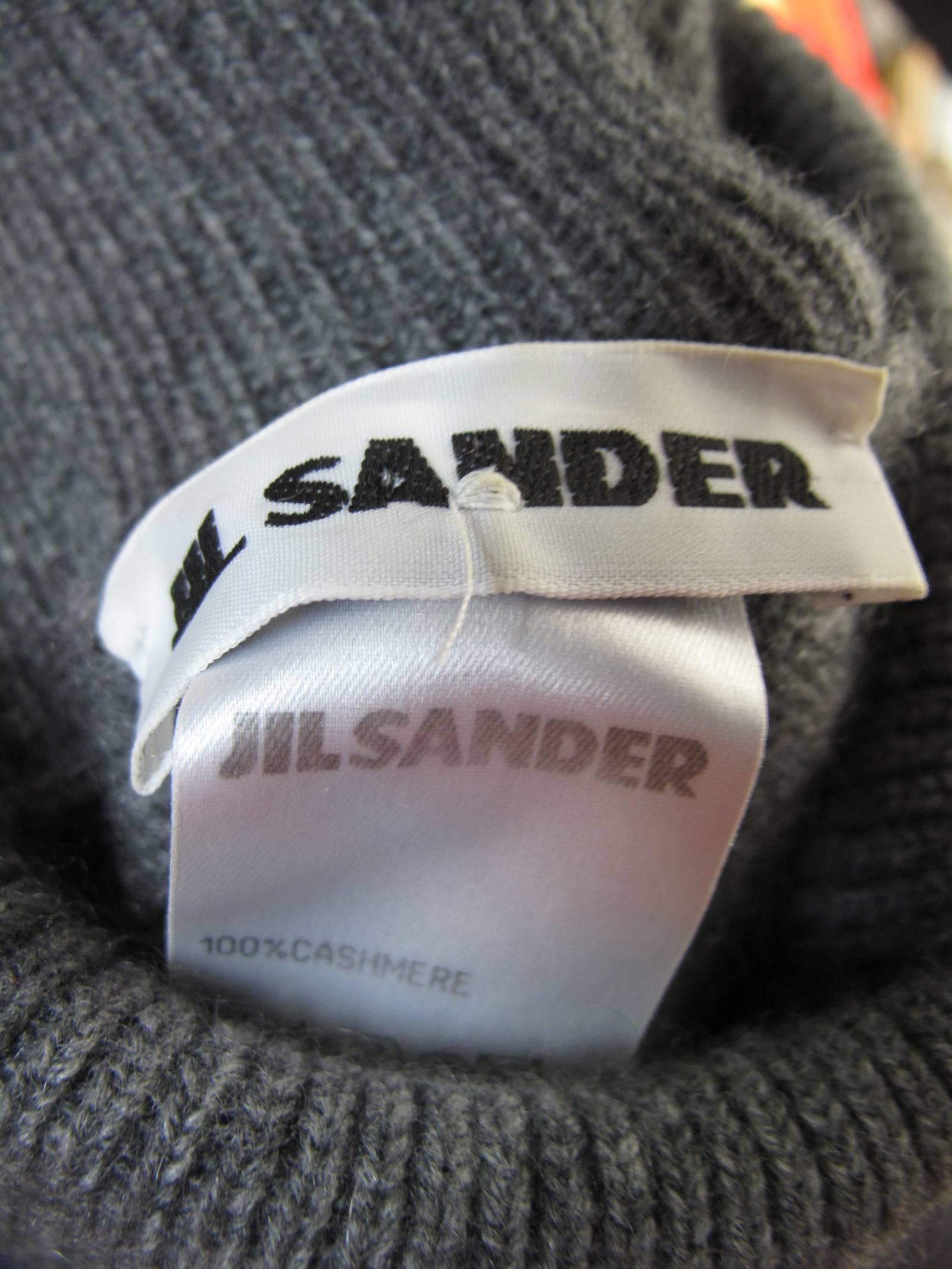 Jil Sander Grey and light grey cashmere sweater.  Condition: Excellent. Size 40
We accept returns for refund, please see our terms.  We offer free ground shipping within the US.  Please let us know if you have any questions. 