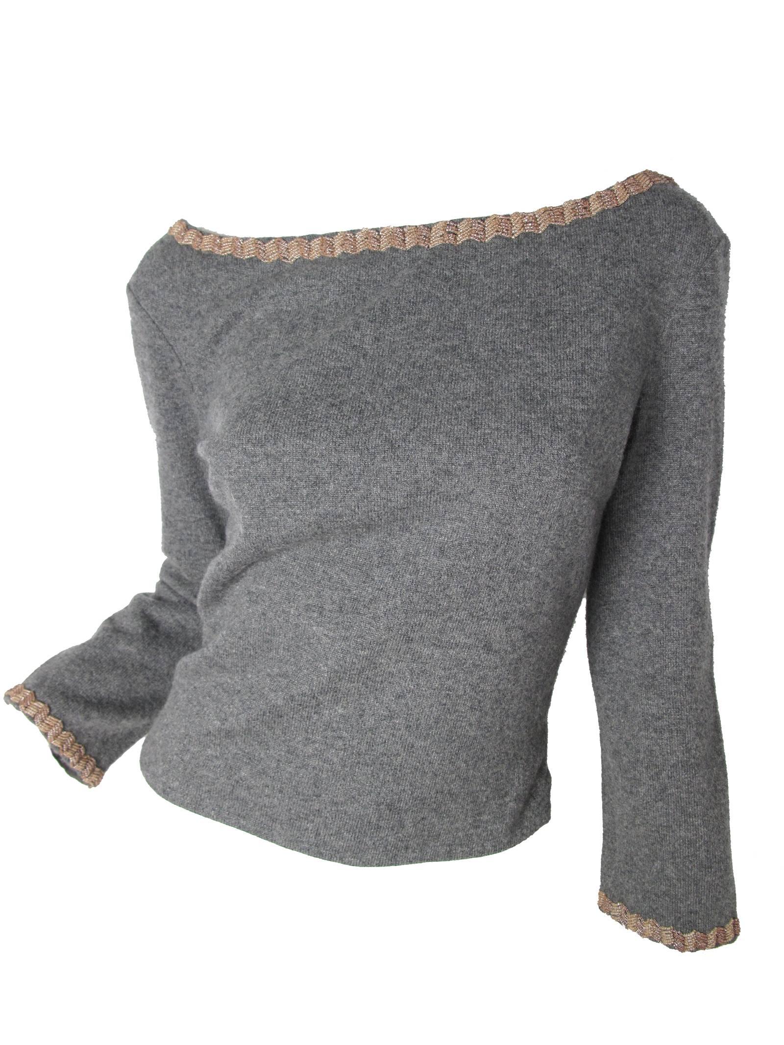 Richard Tyler Couture grey cashmere sweater with beading.  V neck at back . Condition: Excellent. Size L but fits current Med / Large. 

We accept returns for refund, please see our terms.  We offer free ground shipping within the US.  Please let