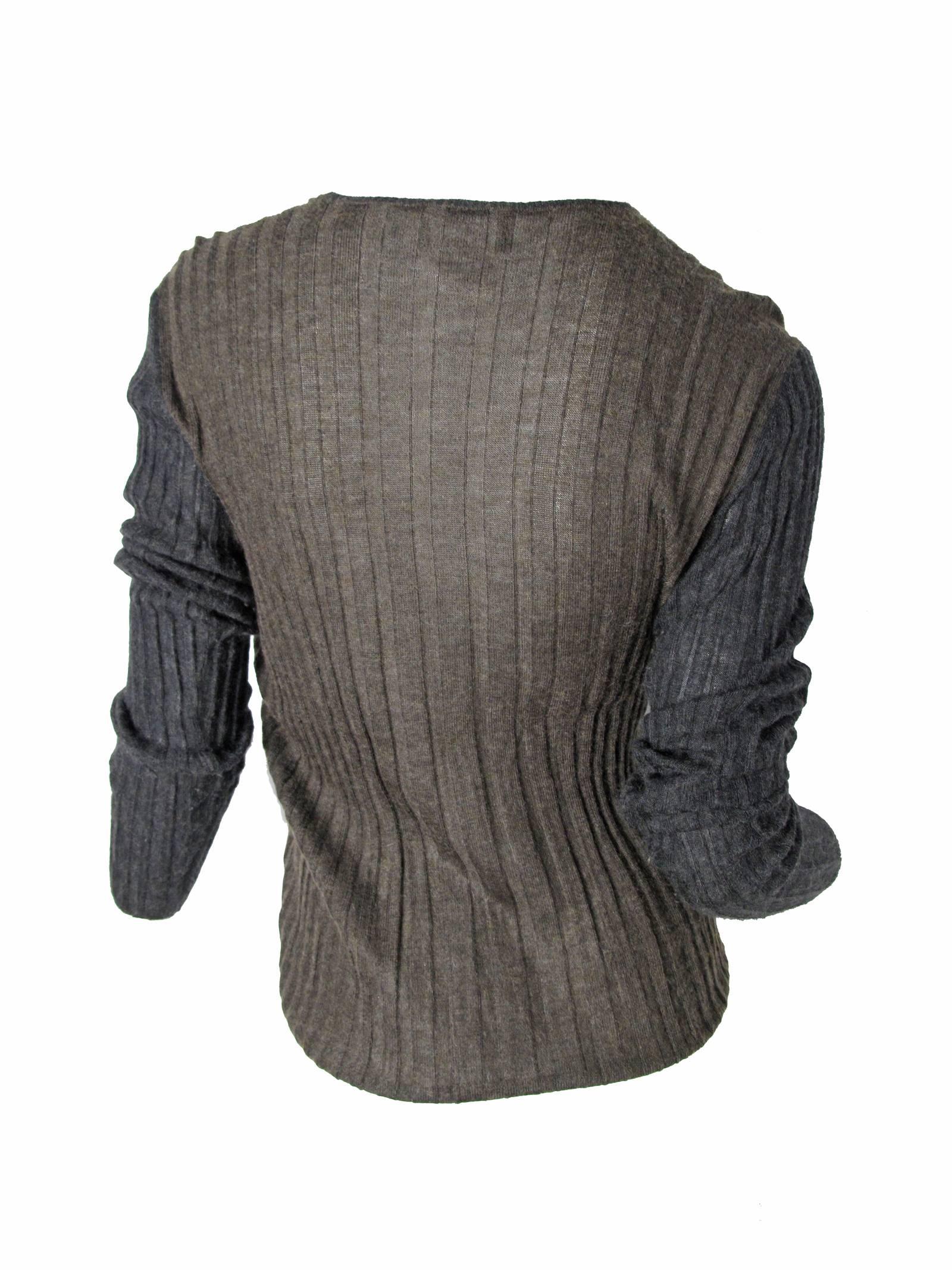 Chanel brown and charcoal ribbed cashmere long sleeve sweater , v-neck.  Condition: Excellent. Circa 1999. Size 40.  
We accept returns for refund, please see our terms.  We offer free ground shipping within the US.  Please let us know if you have