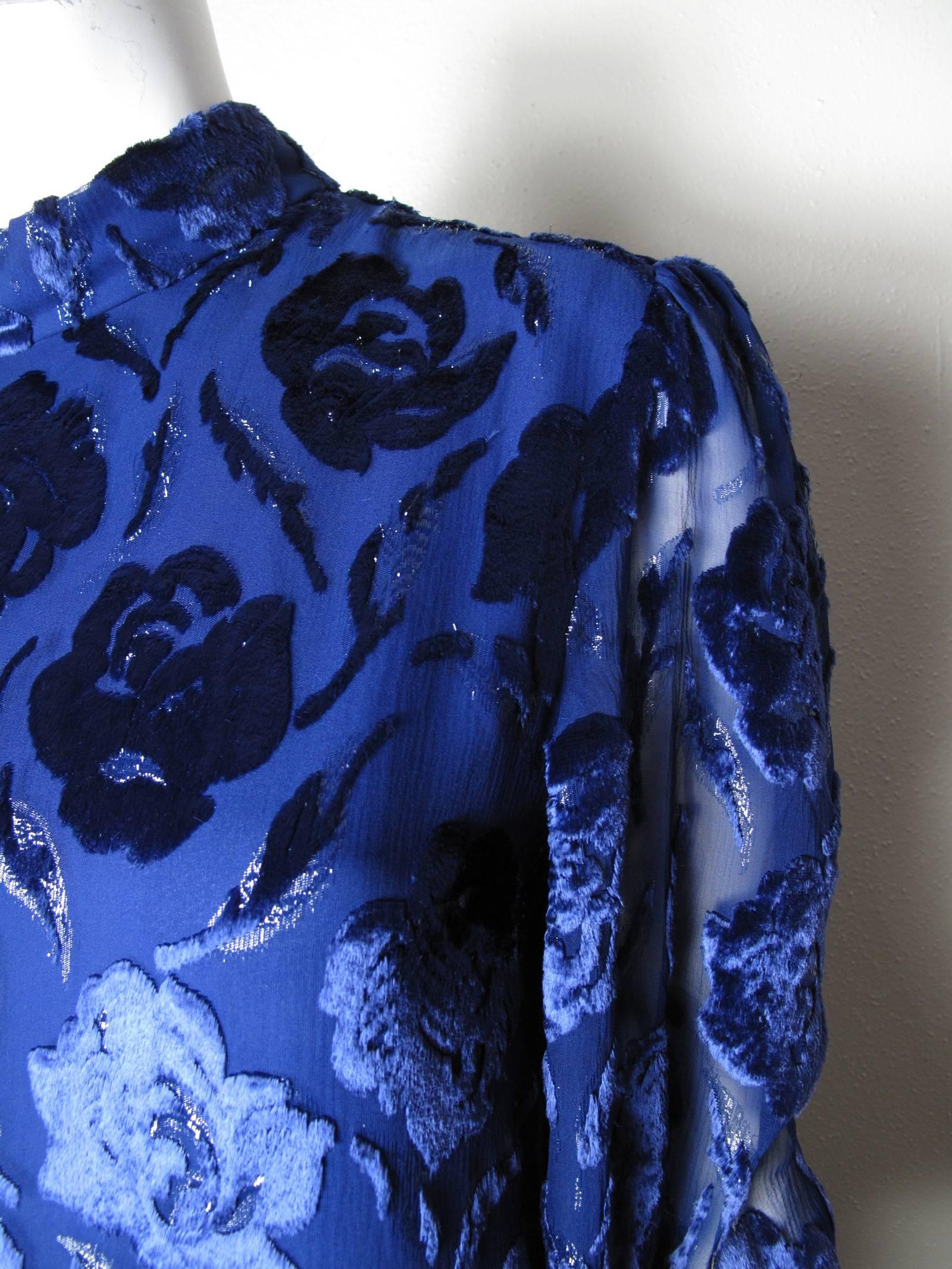 Adele Simpson royal blue floral long sleeve burnt velvet evening gown with sheer sleeves.  Condition: Excellent. Size 10