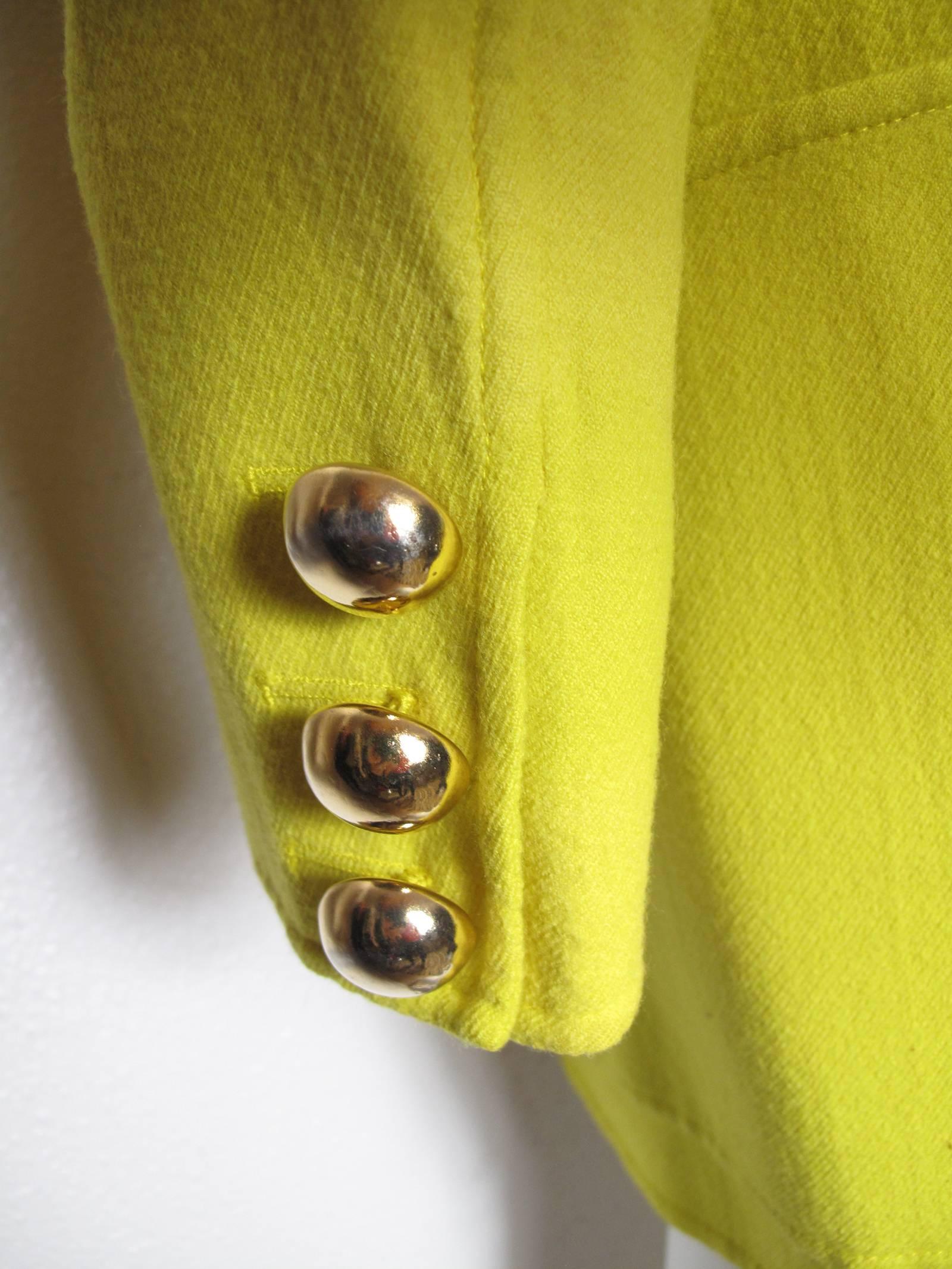 Christian Lacroix bright yellow wool blazer with large gold buttons.  Condition: Excellent.  Size Large
We accept returns for refund, please see our terms.  We offer free ground shipping within the US.  Please let us know if you have any questions.
