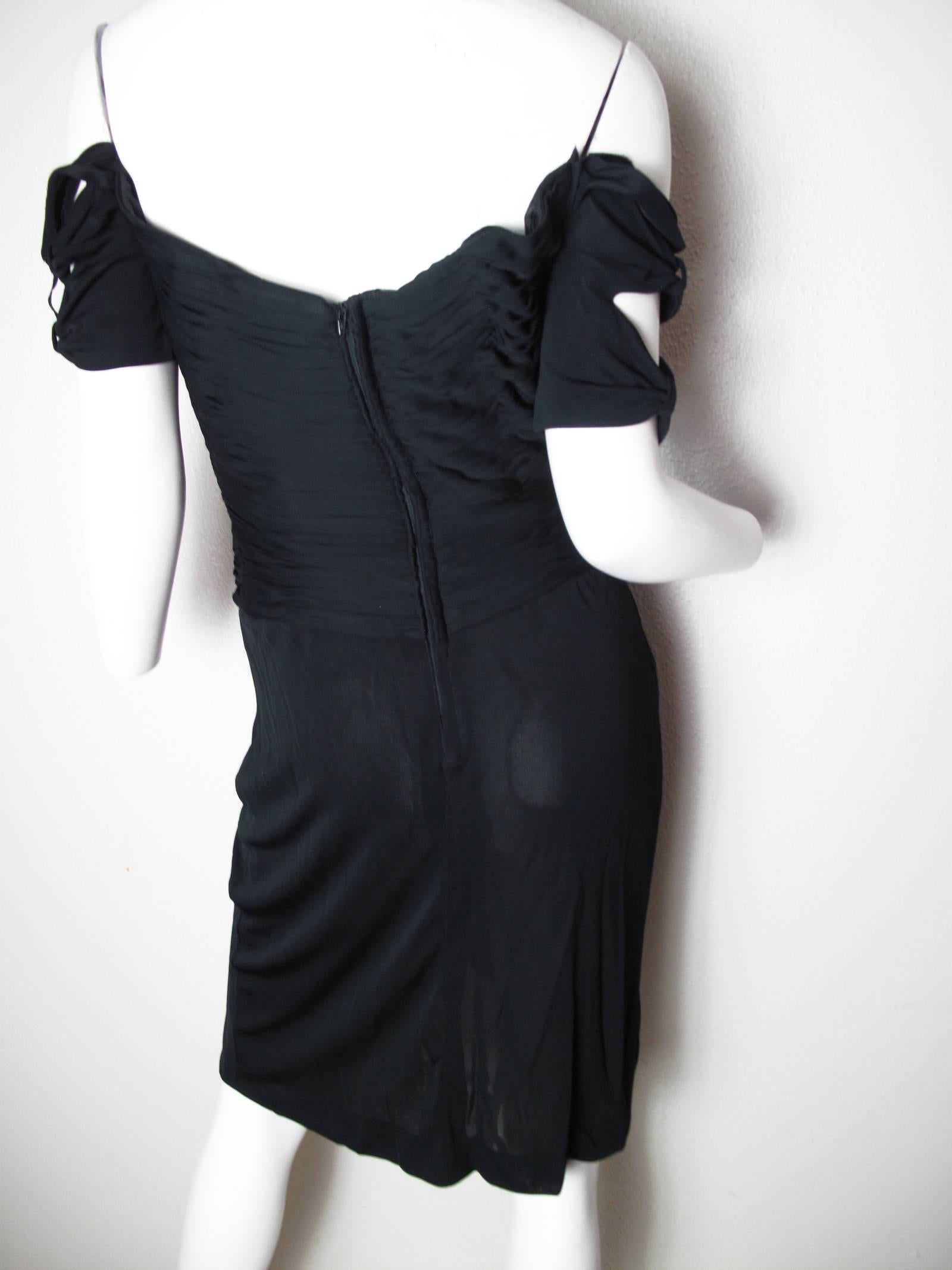 Vicky Tiel black jersey cocktail dress with gathered top and sheer skirt, ties at sleeves. Boning in bodice . 37