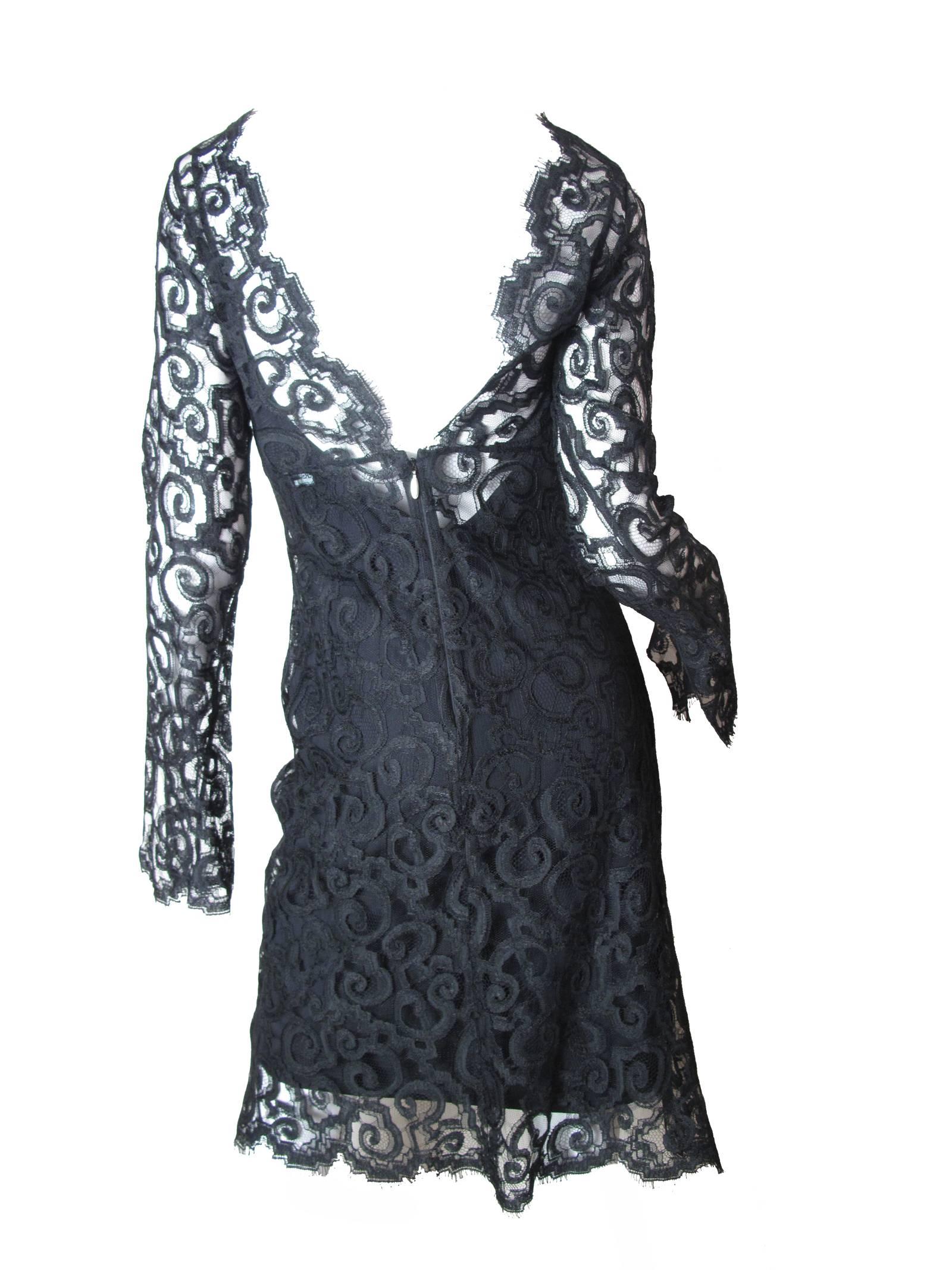 Versus black lace cocktail dress.  Condition: Excellent.  Size 8

We accept returns for refund, please see our terms.  We offer free ground shipping within the US.  Please let us know if you have any questions. 
