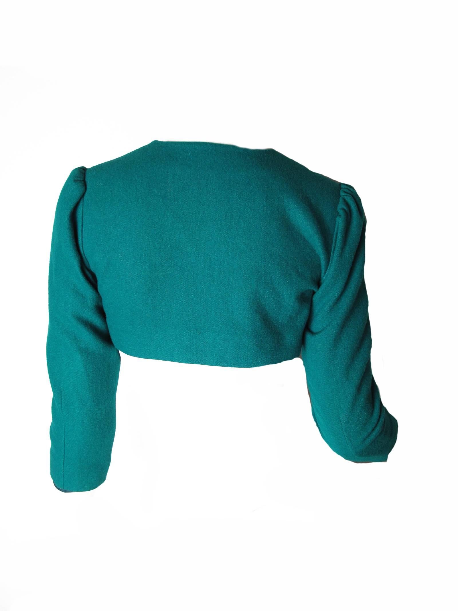 Pierre Cardin aqua wool bolero jacket with Eiffel Towers on it and little rhinestones.  Condition: Excellent. Size Small
We accept returns for refund, please see our terms. We offer free ground shipping within the US. Please let us know if you have