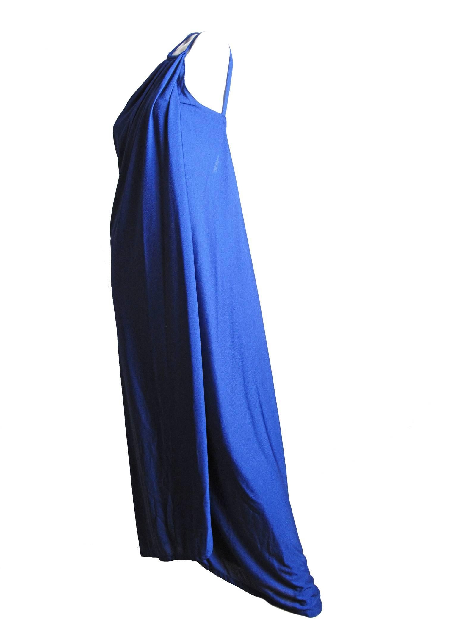 Adele Simpson blue gown with one shoulder.  Fabric has stretch.  Condition: Excellent. Size 12 or current US 10 - 12

We accept returns for refund, please see our terms.  We offer free Ground Shipping within the US.  Please let us know if you have