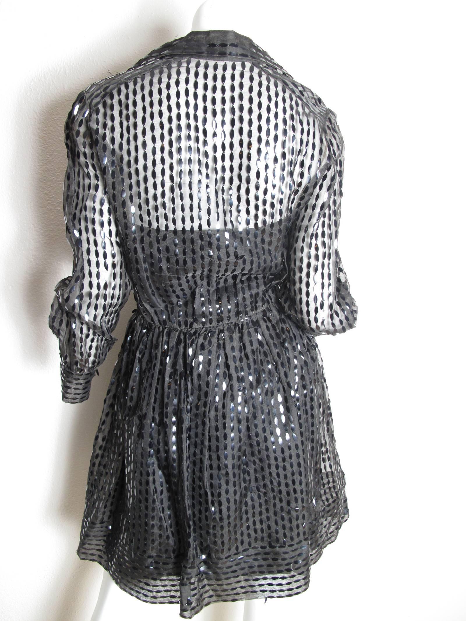 Mollie Parnis black sheer dress with sequins with slip underneath.  Condition: AS IS, many sequins missing.  Size 6 - 8

 We accept returns for refund, please see our terms.  We offer free Ground shipping within the US.  Please let us know if you