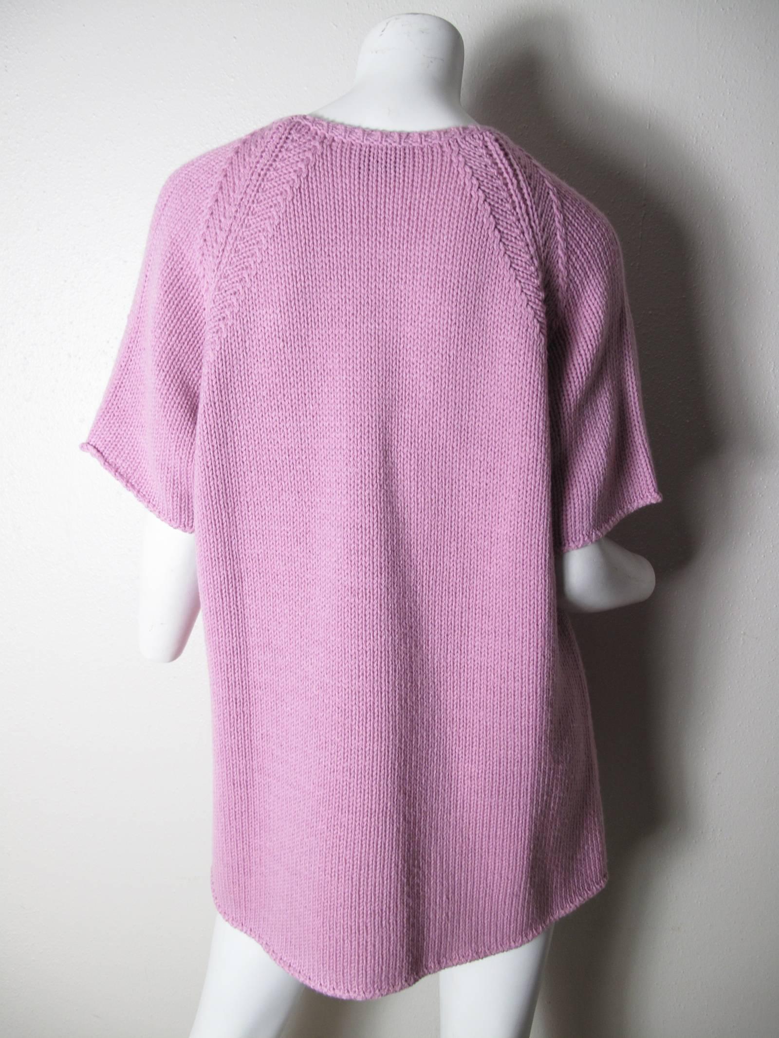 Gianfranco Ferre purple knit short sleeve sweater.  Wool & Acrylic blend. Condition: Excellent.  Size Large
We accept returns for refund, please see our terms. We offer free ground shipping within the US. Please let us know if you have any