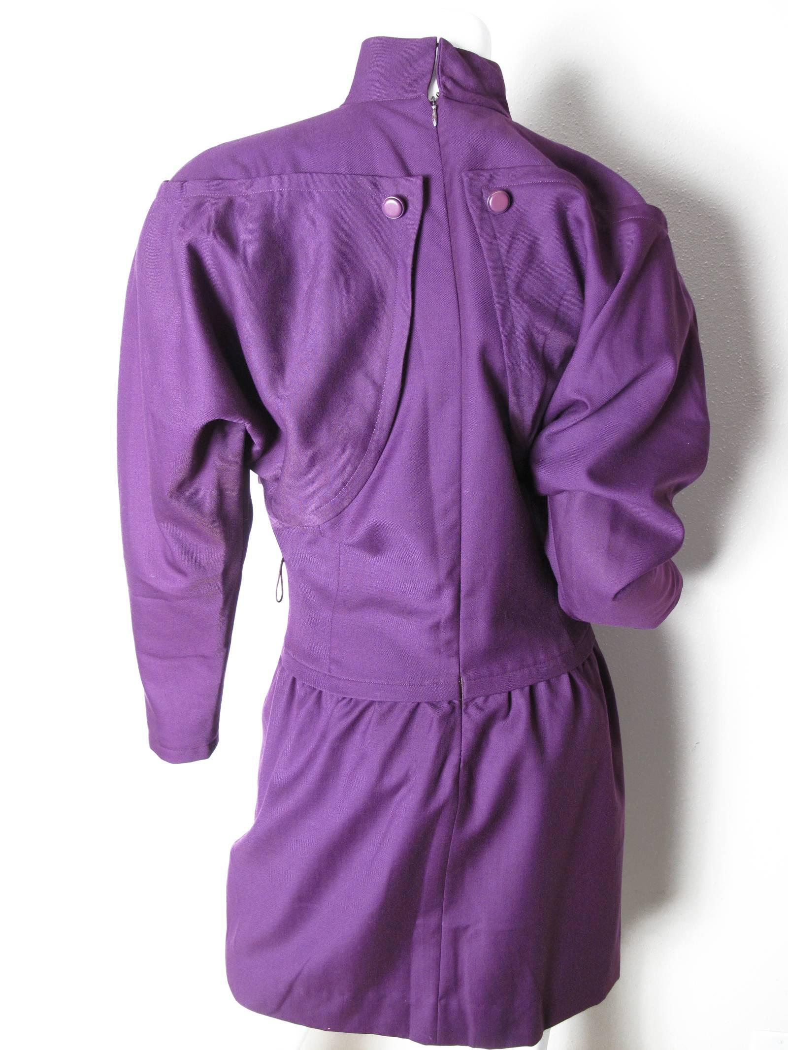 1980s Courreges purple wool dress.  Condition :Excellent.  Size 00 or small
We accept returns for refund, please see our terms.  We offer free ground shipping within the US.  Please let us know if you have any questions. 