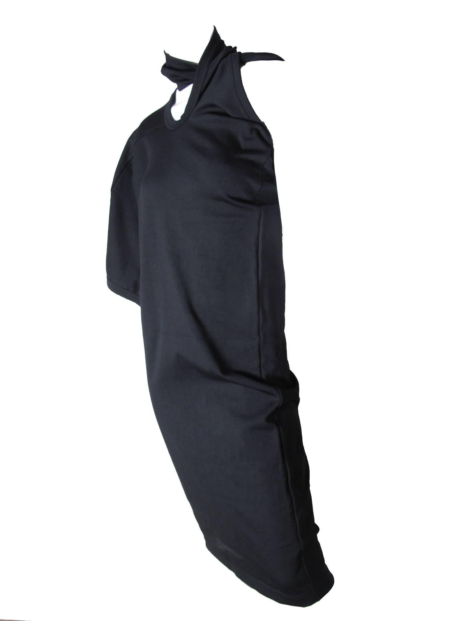 1990 Comme des Garcons black dress with one shoulder.  Nylon and Polyurethane dress. Size M  
Condition: Excellent. 
34