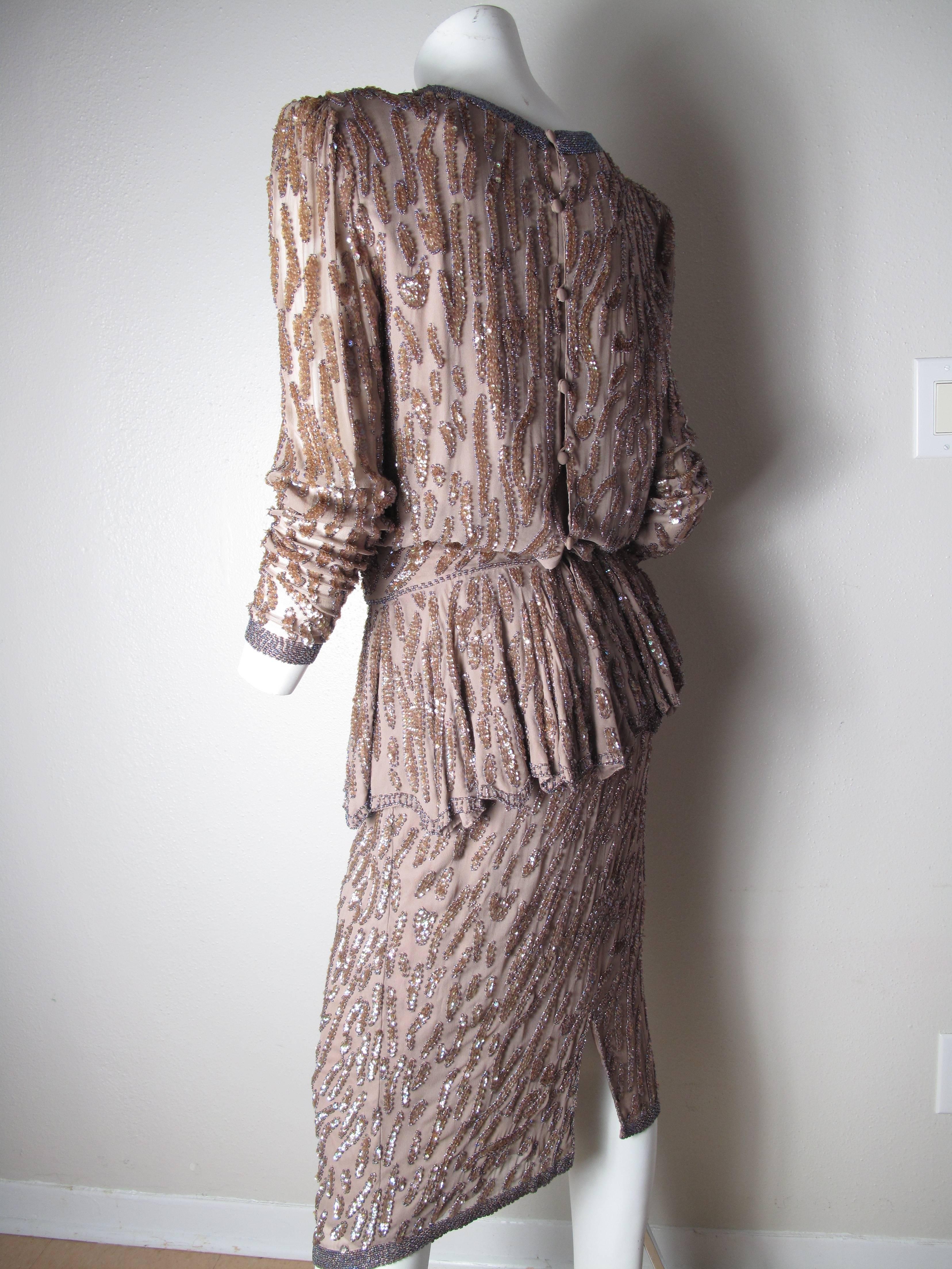Oleg Cassini pewter beaded silk top and skirt.  Condition: Excellent. Size 10
Fits current size 8
Top:
40