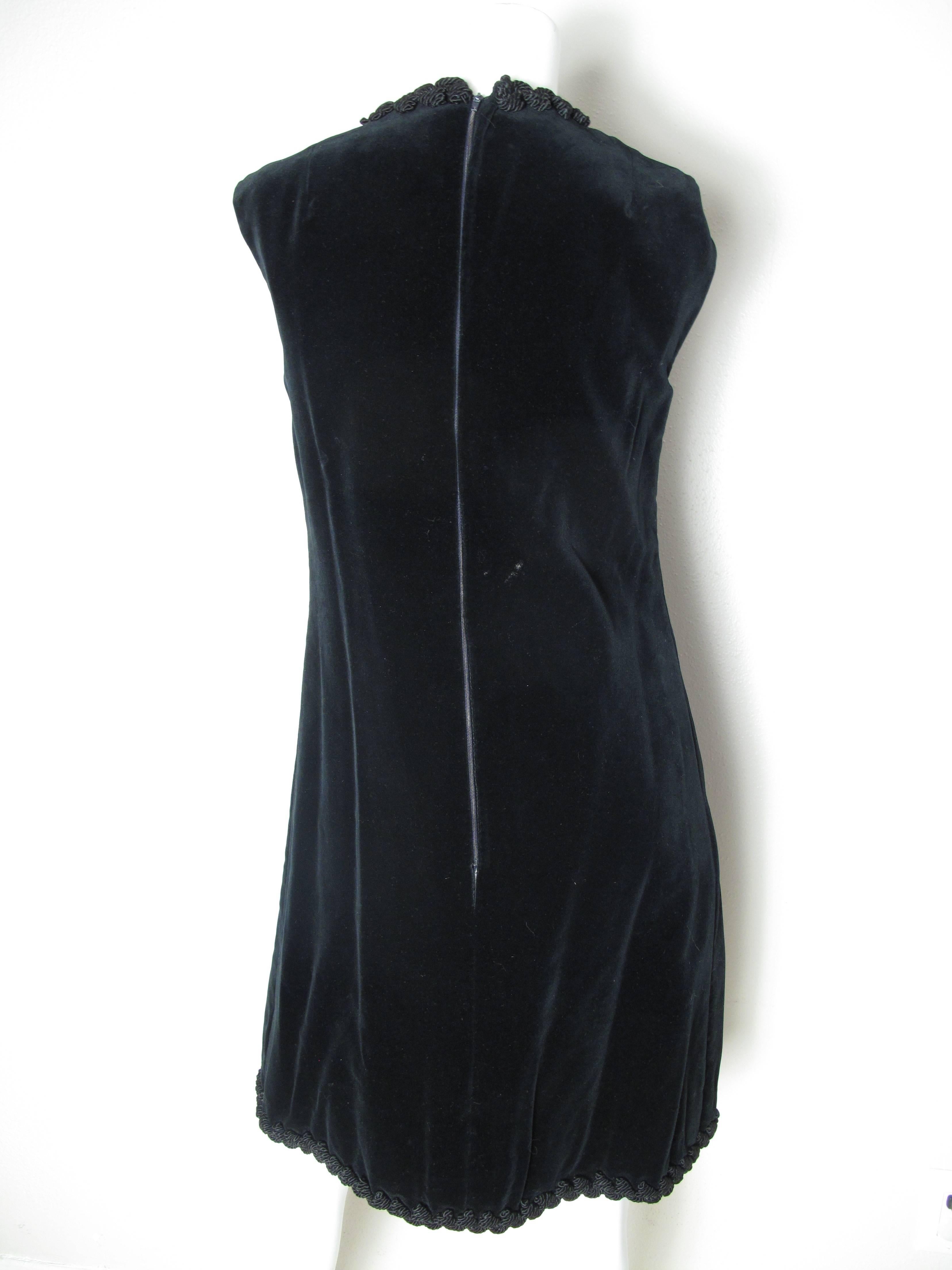 Bill Blass black velvet dress with braided rope trim and toggle closures.  Condition: Excellent.  Marked size 12 but fits more of a current 8 - 10

We accept returns for refund, please see our terms.  We offer free ground shipping within the US. 