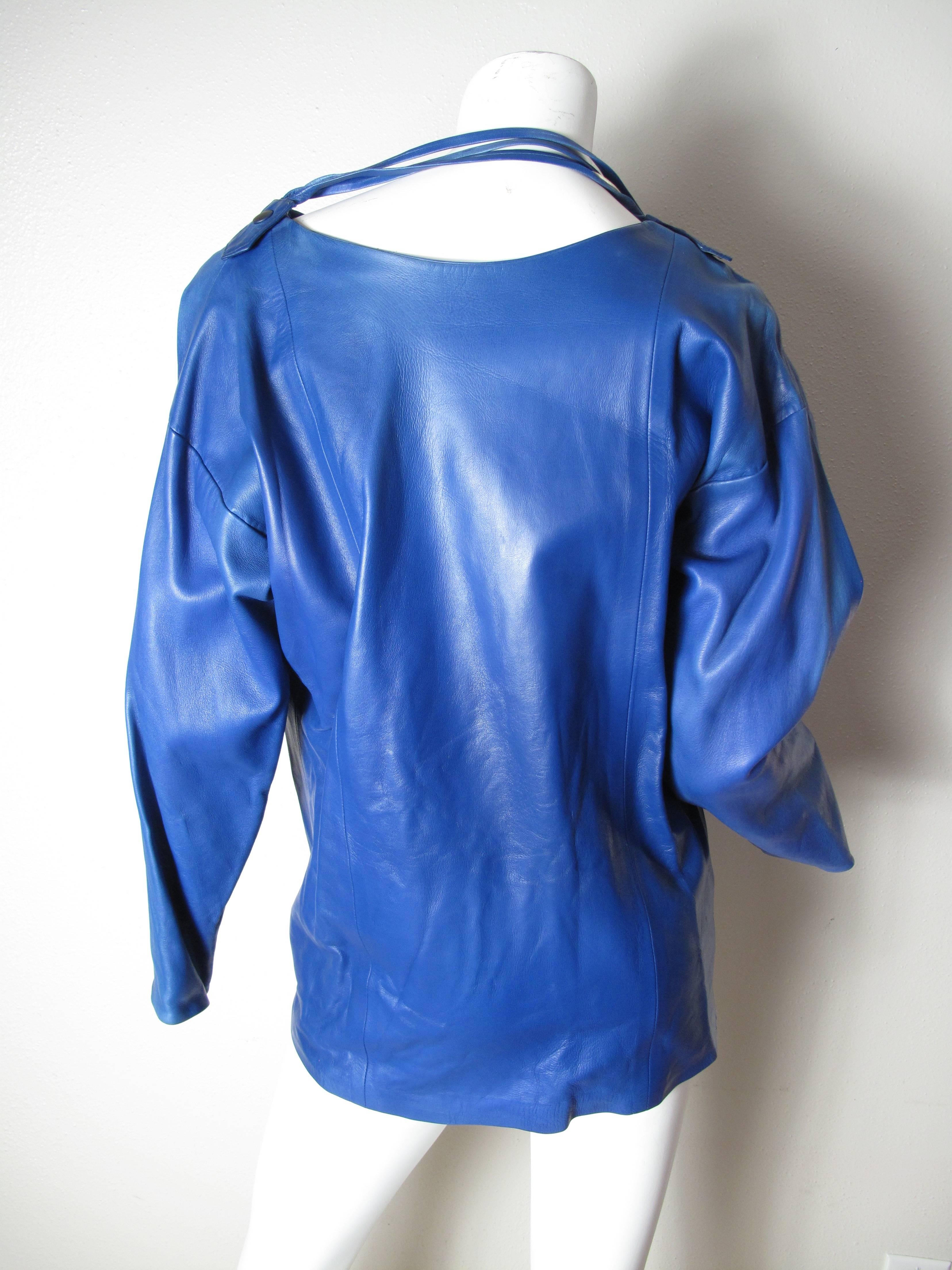 1980s Guy Laroche blue leather top. Condition: Good, some spots.  Size Large

We offer free ground shipping within the US.  We accept returns for refund, please see our terms.  Please let us know if you have any questions. 