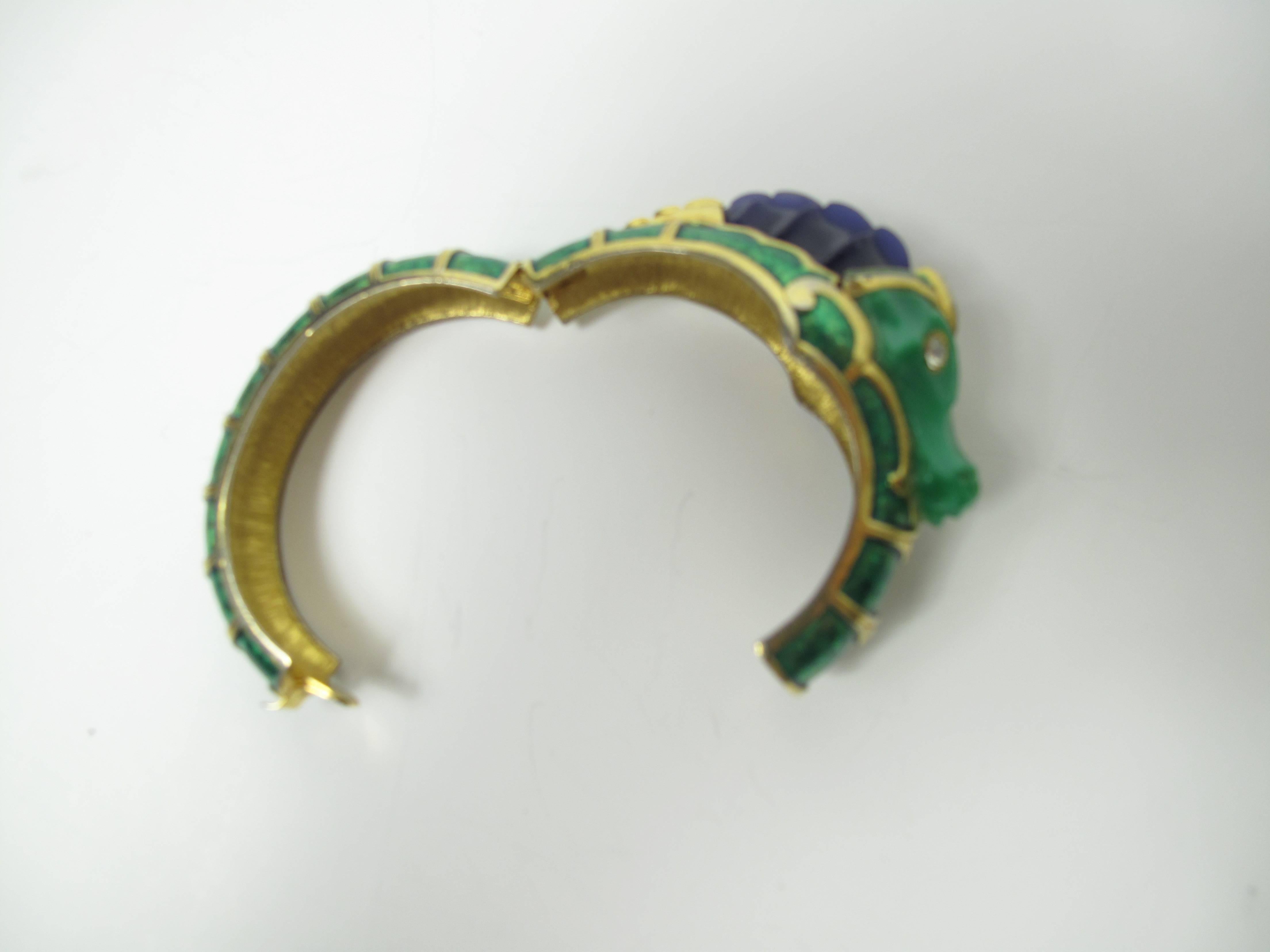 Hattie Carnegie enamel seahorse bangle with rhinestone eyes.  Hinged opening. Stamped Hattie Carnegie.  Condition: good, some all over wear. 

We accept returns for refund, please see our terms.  We offer Free Ground Shipping within the US.  Please