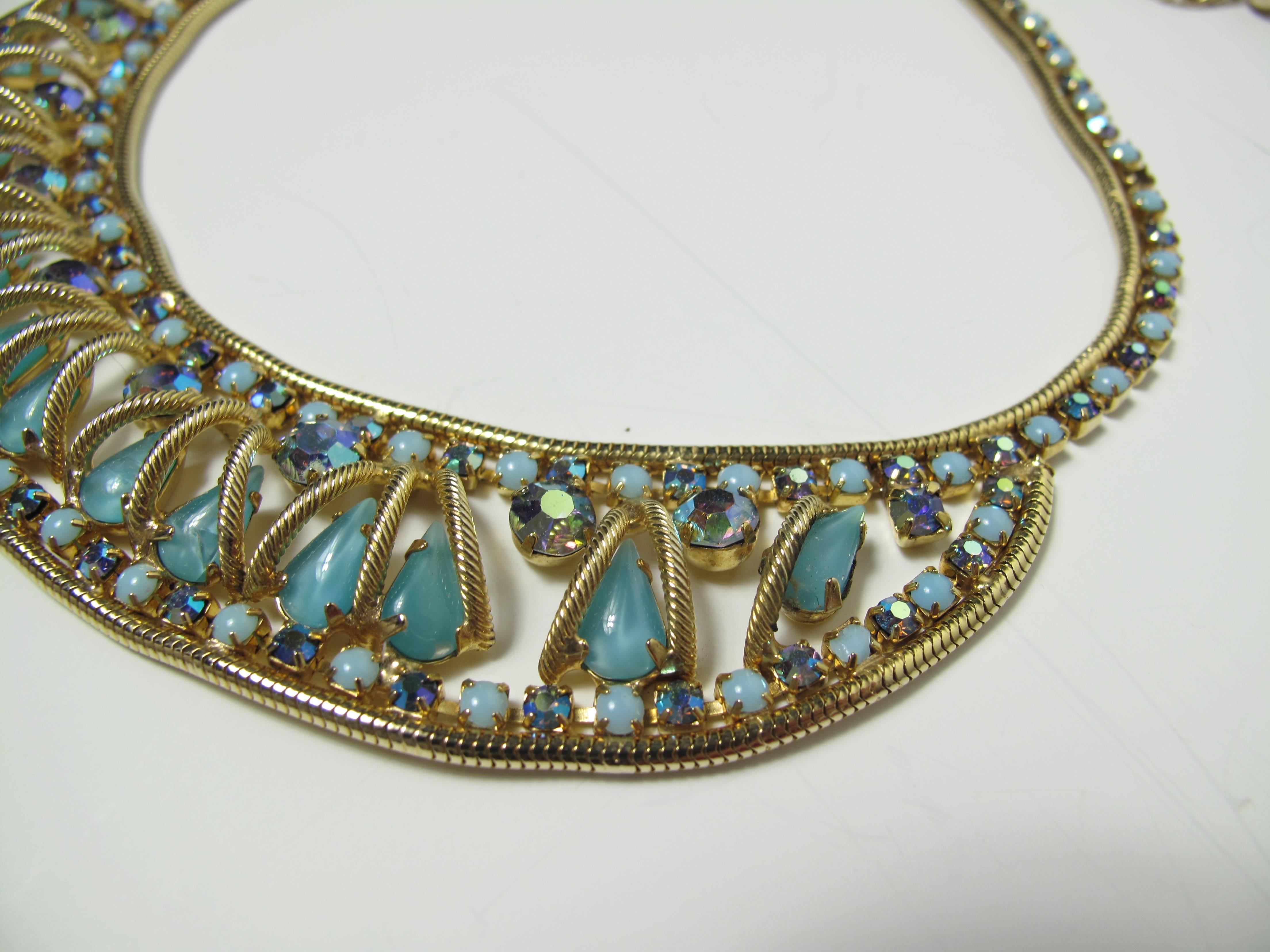 1950s goldtone snake chain and blue rhinestones choker and clip on earrings set. Condition: Excellent.

We accept returns for refund, please see our terms.  We offer Free Ground Shipping within the US.  Please let us know if you have any questions. 
