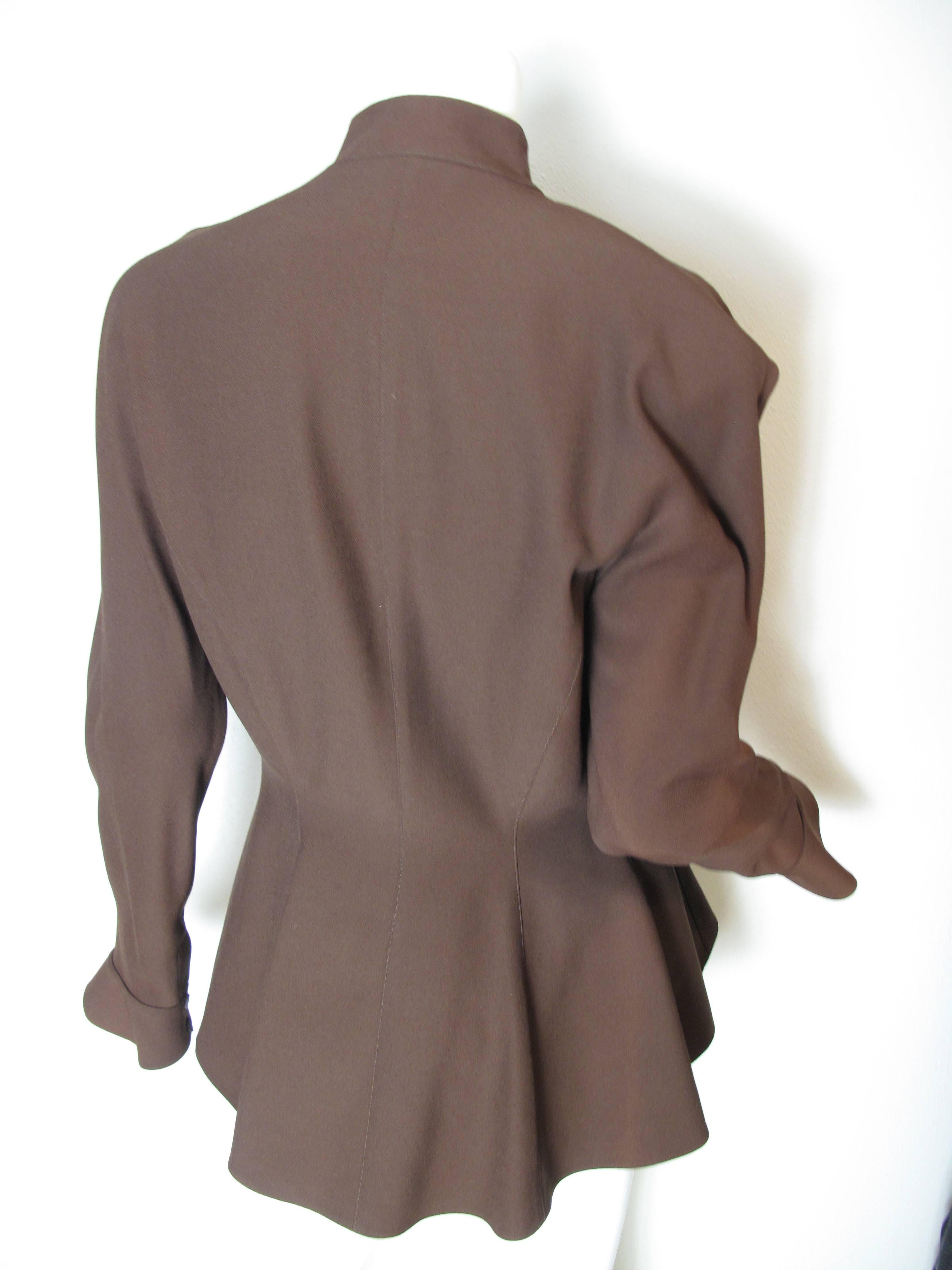 Thierry Mugler brown wool fitted blazer with interesting cuffs and collar. 
Condition: Excellent. Size 40/ US 6/8

 We accept returns for refund, please see our terms.  We offer free Ground shipping within the US.  Please let us know if you have any
