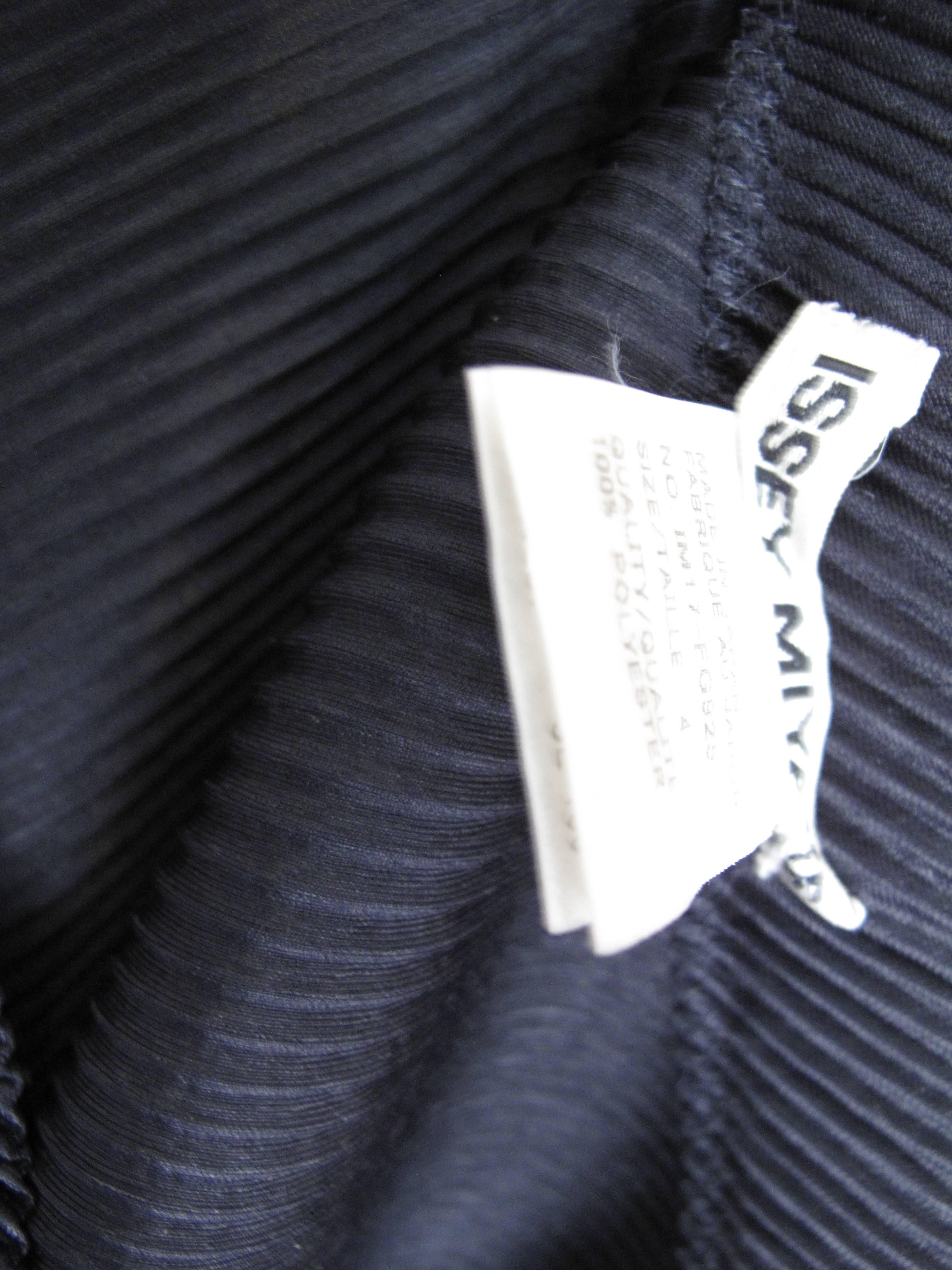 Issey Miyake black pleated asymmetrical skirt.  Condition: Excellent. Polyester fabric. Japan Size 4 

We accept returns for refund, please see our terms.  We offer free ground shipping within the US. Please let us know if you have any questions.
