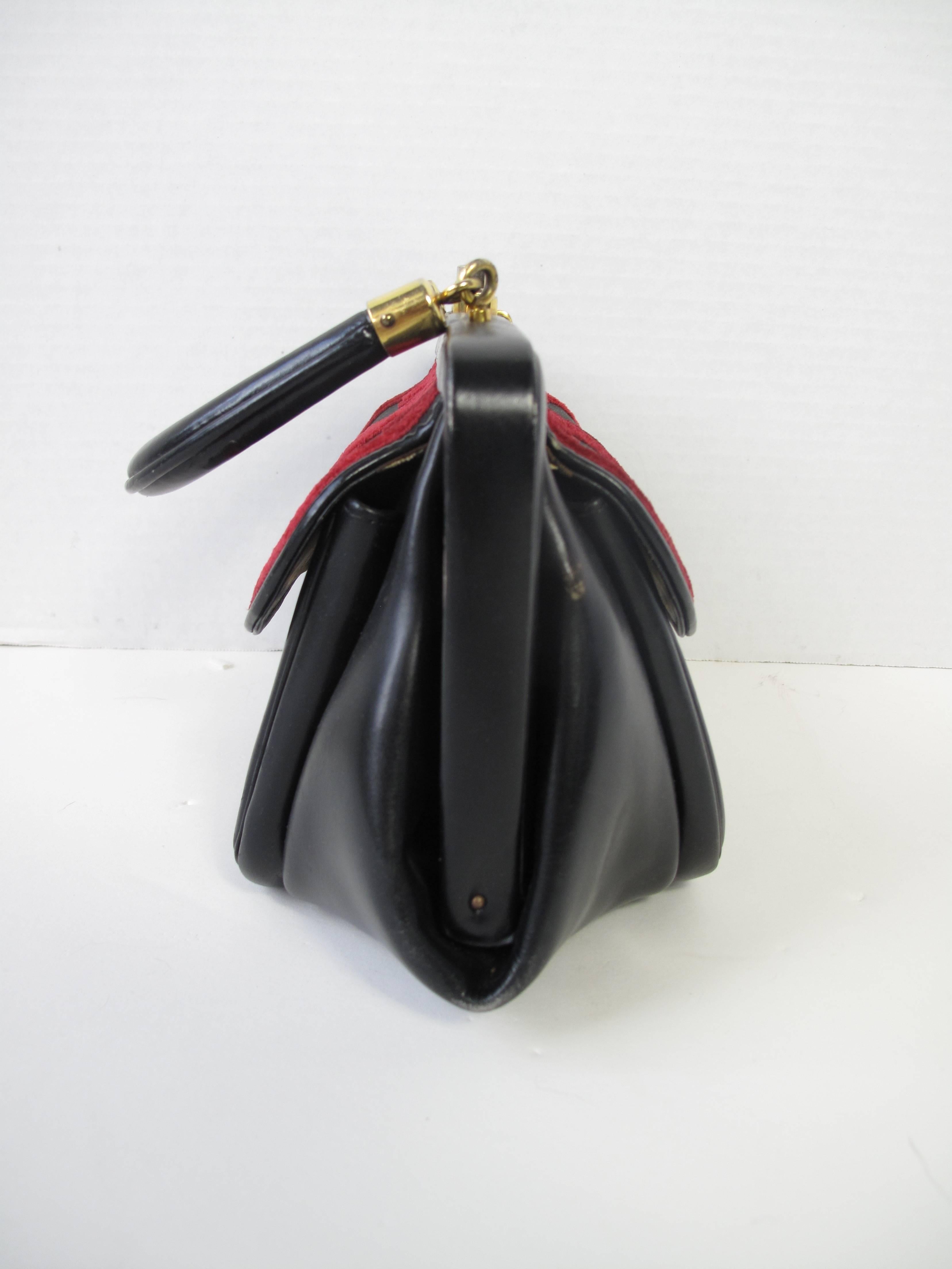 Roberta di Camerino black leather bag with red velvet.  Condition: Very good. 
