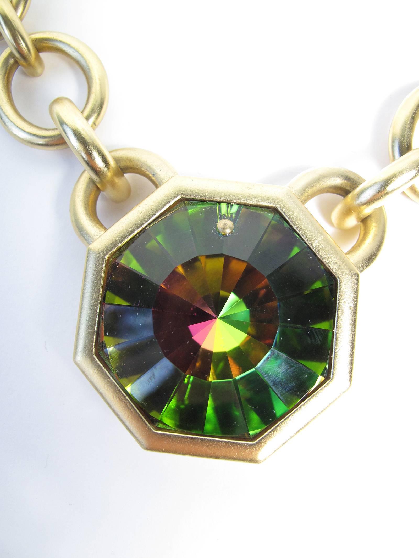 1980s YSL octagon shape crystal with iridescent colors with brushed gold tone necklace and earrings set.   Numbered 295 out of 500 made. Adjustable 13-16 1/2" Long
Large Pendant is 2" x 2"   Condition: Excellent. 

We accept returns