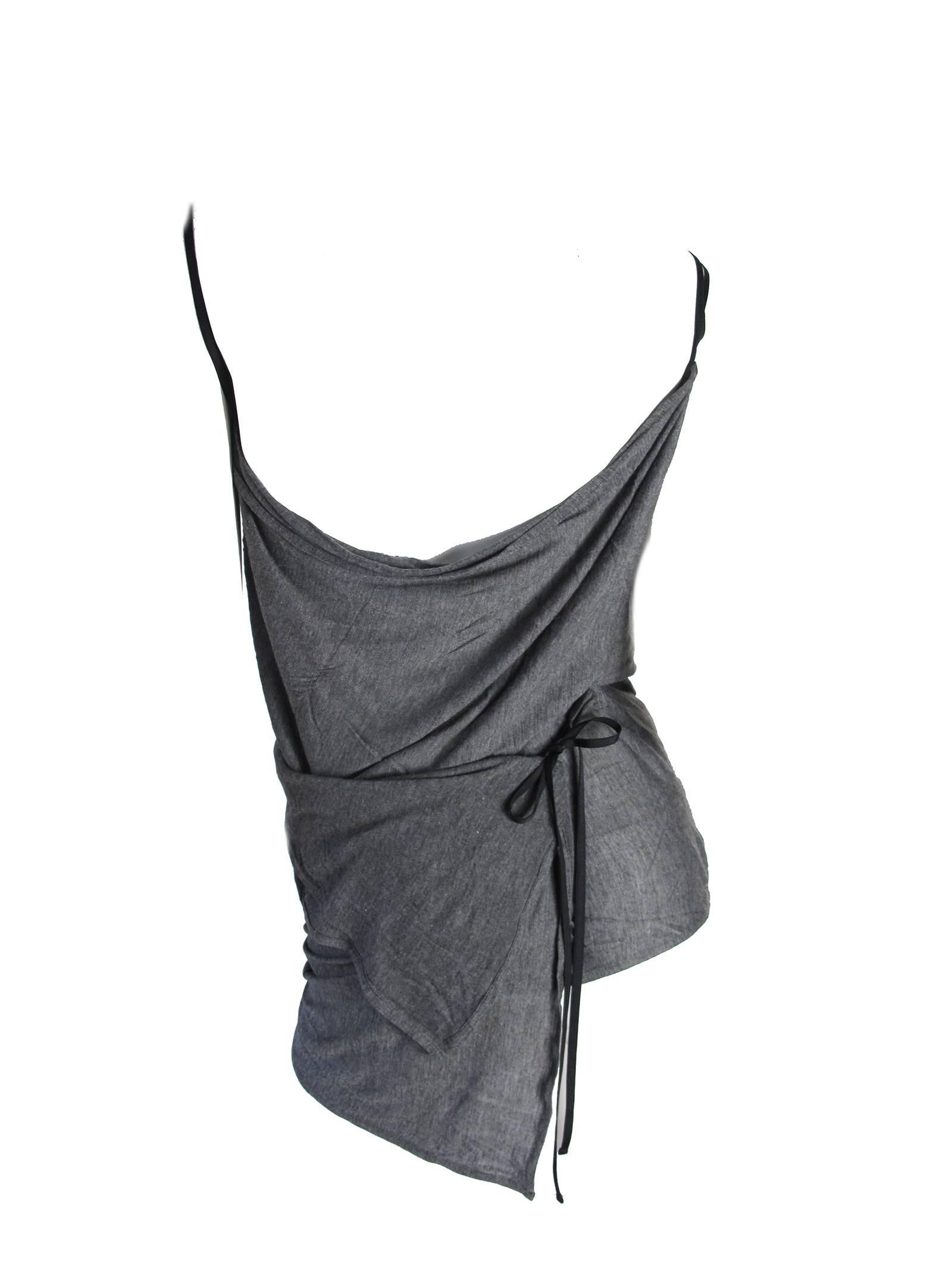 Ann Demeulemeester grey rayon tank top that wraps around twice and ties in back with matching wrap skirt.  Very interesting and wearable set.  Soft rayon fabric.  Condition: Excellent Size 40/ US 6 

We accept returns for refund, please see our