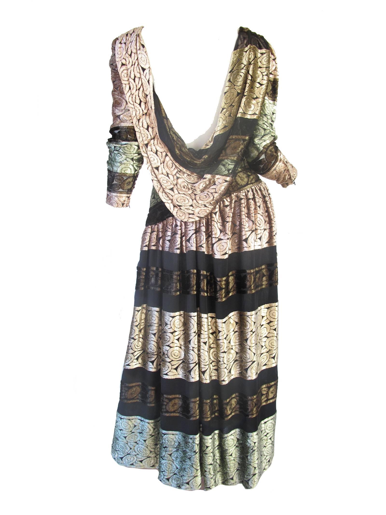 Mary McFadden pastel pink, mint green and brown burnout velvet dress with scoop back.  Sheer though out.  Zippers at sleeves and on side.  Condition: Excellent Size 6 

We accept returns for refund, please see our terms.  We offer free ground