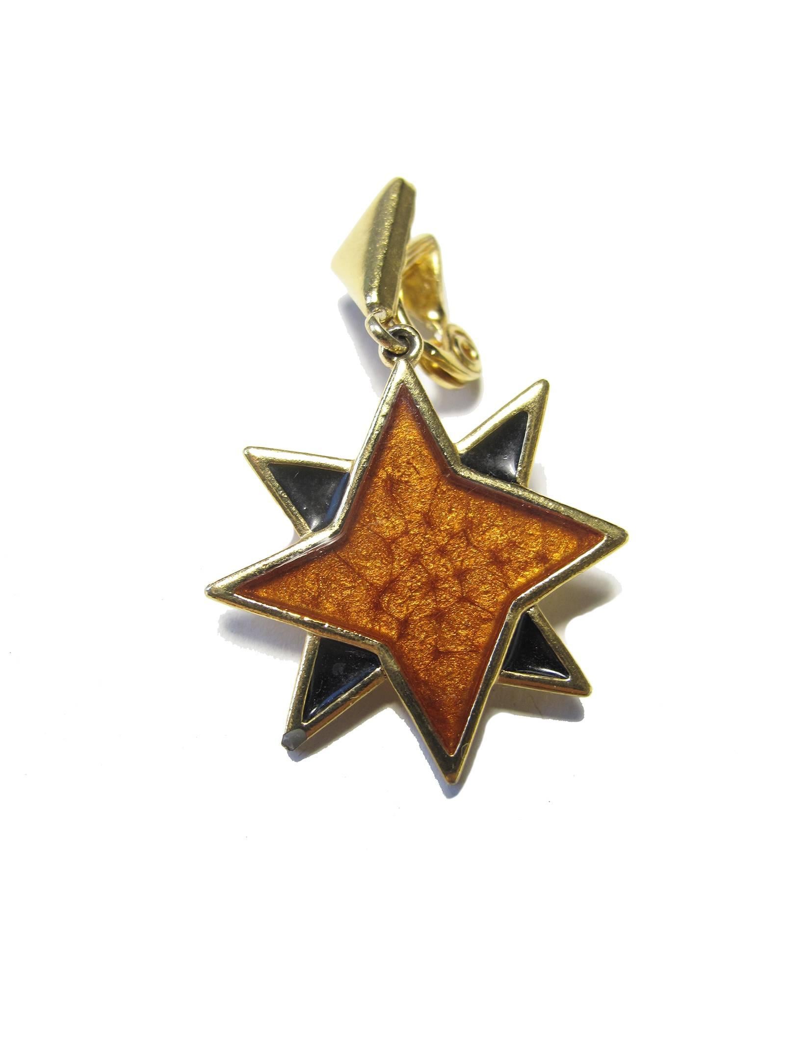 1980s Yves Saint Laurent enamel and metal star earrings. Clip on.  Condition: Very good, some wear.
We accept returns for refund, please see our terms.  We offer free ground shipping within the US. 