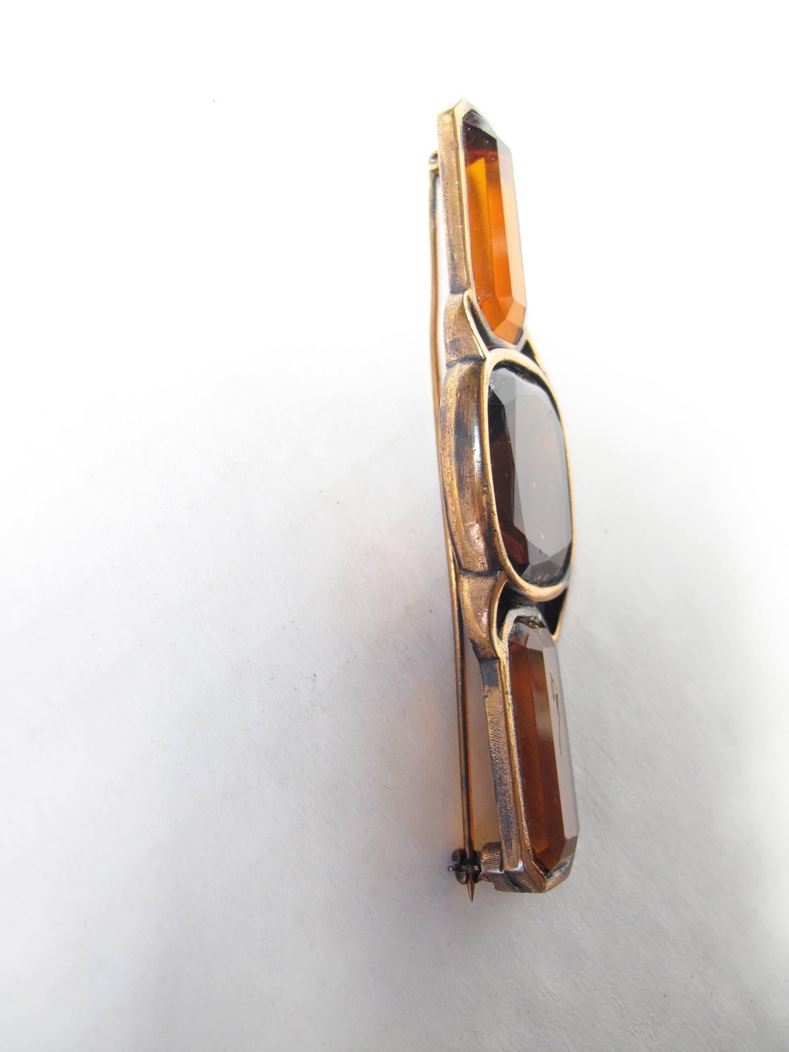 1980s Yves Saint Laurent copper and glass brooch.  Condition: Good, some wear to copper and scratch on glass. 
We accept returns for refund, please see our terms.  We offer free ground shipping within the US. 