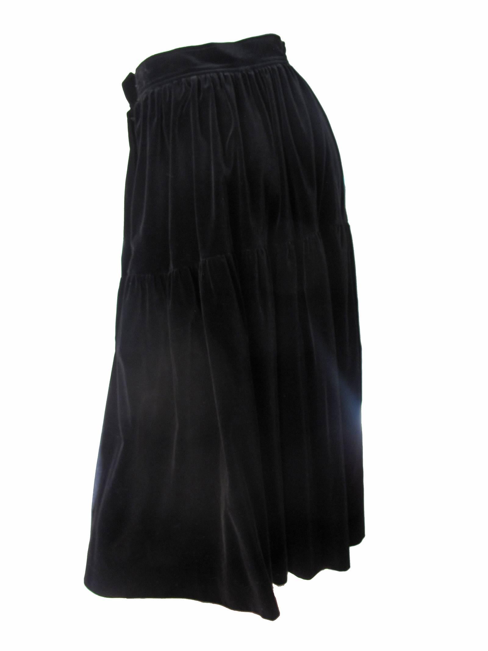 1980s Yves Saint Laurent black velvet peasant skirt.  Condition: Very good. Size 40/ current us 6
We accept returns for refund, please see our terms.  We offer free ground shipping within the US. 
