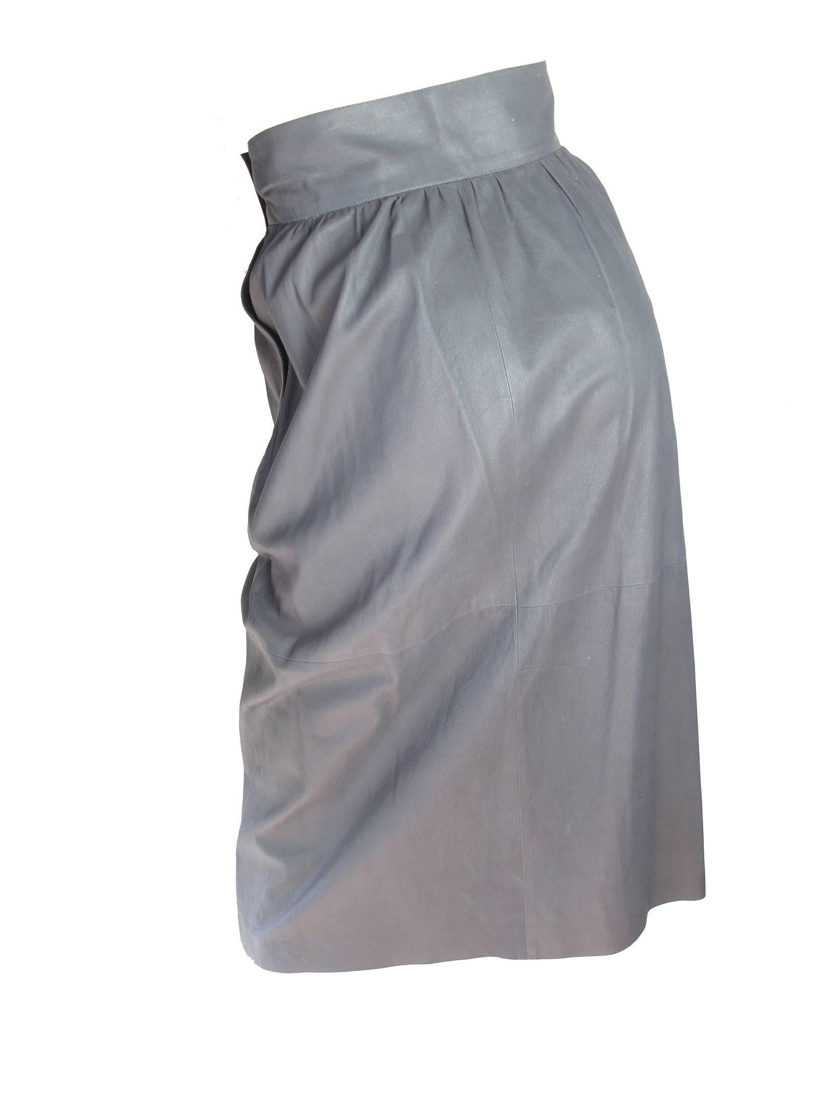 Valentino grey leather wrap skirt. Condition: Very good.  Size 6

We accept returns for refund, please see our terms.  We offer free ground shipping within the US.
