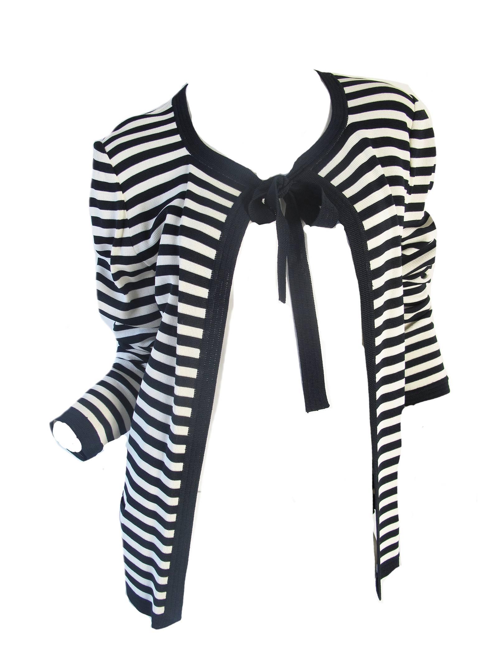 Ungaro navy and cream striped cardigan with tie at neck. 100% rayon. Condition: Excellent, never worn. Size M
We accept returns for refund, please see our terms.   We offer free ground shipping within the US. 