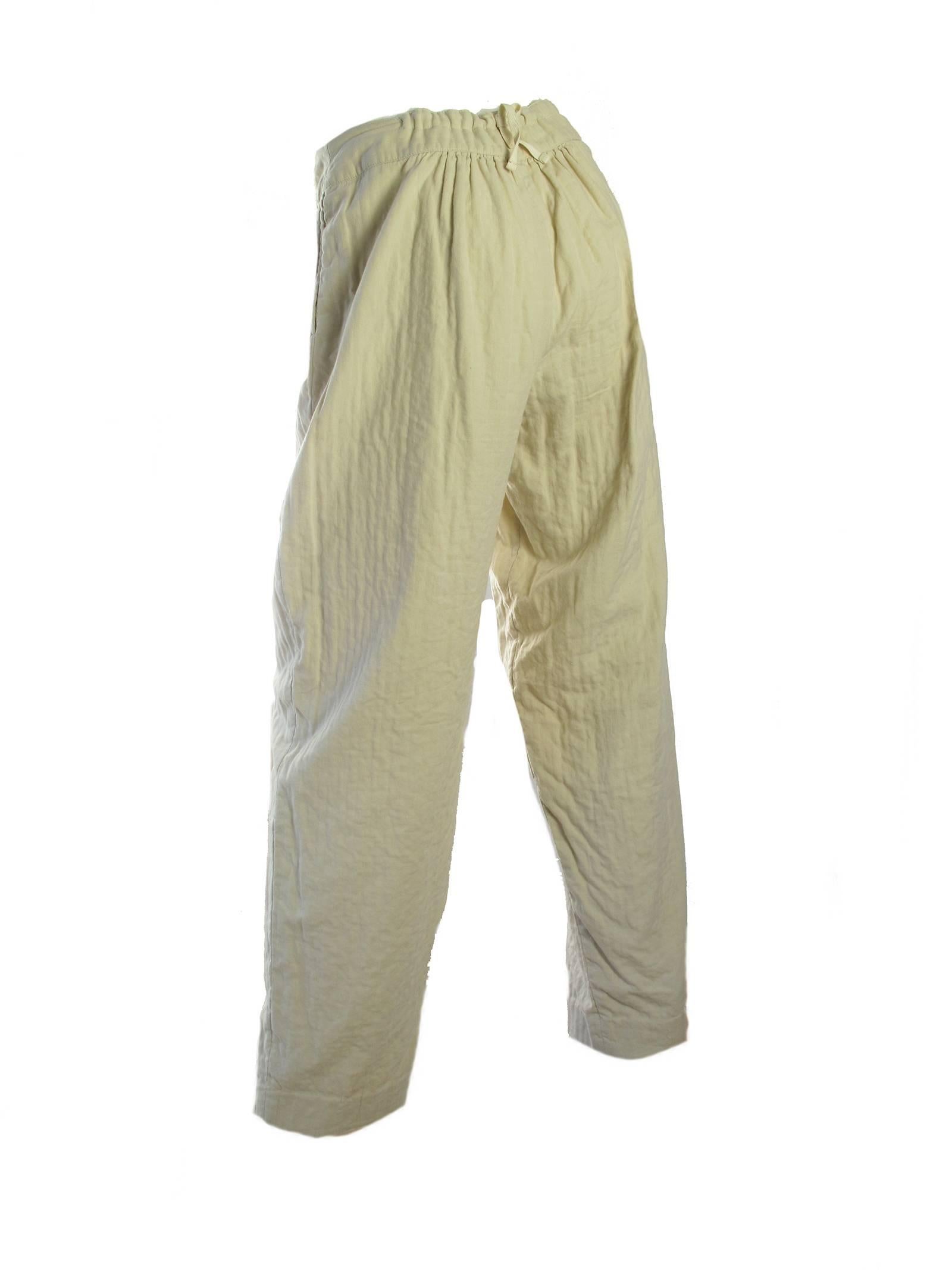 1980's Issey Miyake cream cotton pants.  High waisted with drawstring at back. Condition: very good, spot on front, small hole.  Size 6/ 8