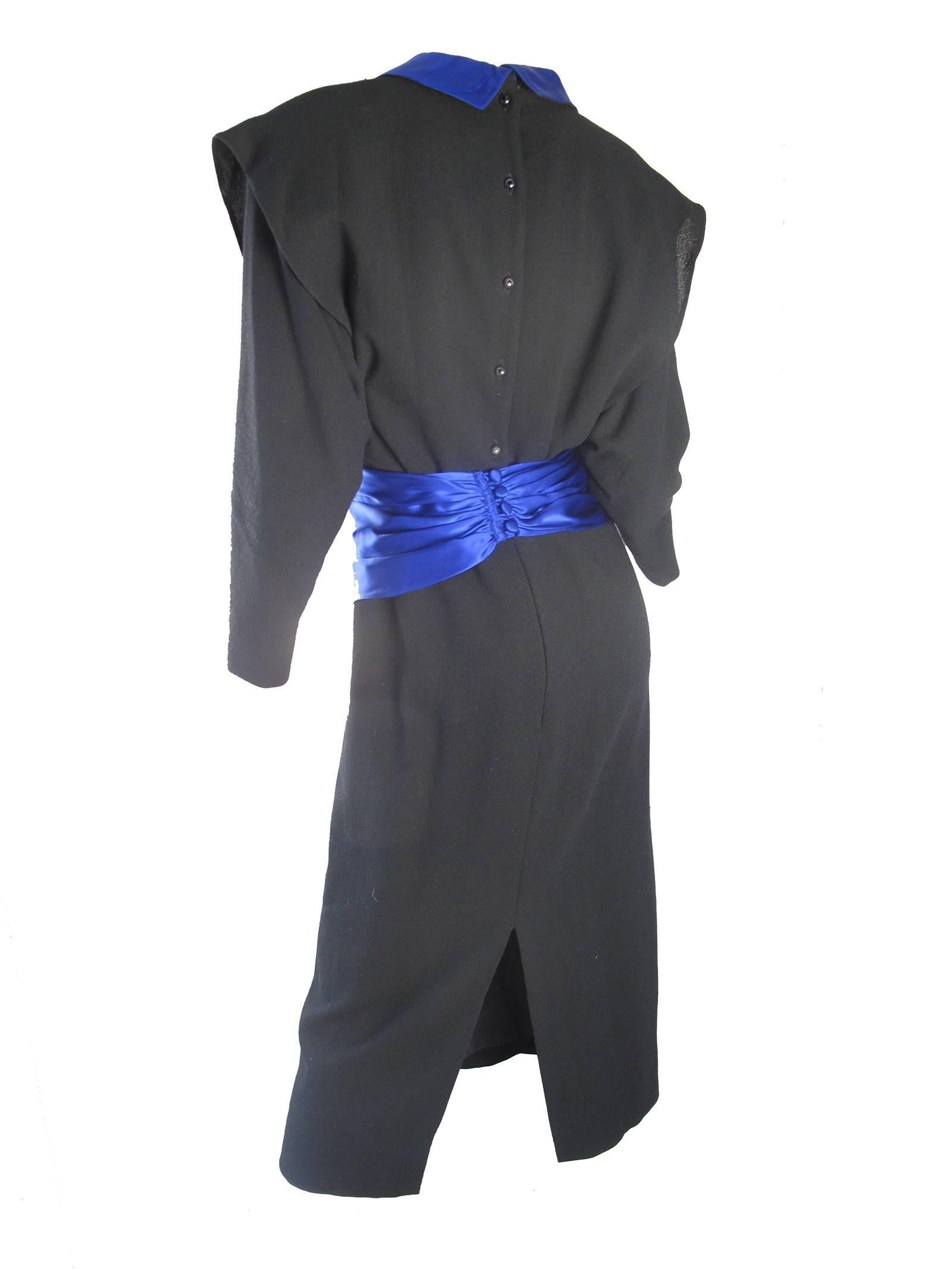 Adam Beall black wool crepe and blue satin dress.  Waist band wraps around waist and closes in back.  Condition: Excellent. Size 8
We accept returns for refund, please see our terms. We offer free ground shipping within the US. 