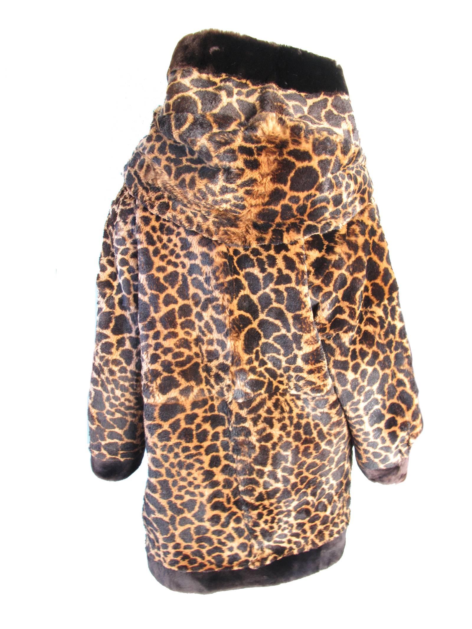 Yves Saint Laurent oversized hooded beaver fur coat, 1980s.  Condition: Excellent. Size Large

We accept returns for refund, please see our terms.  We offer free ground shipping within the US. 