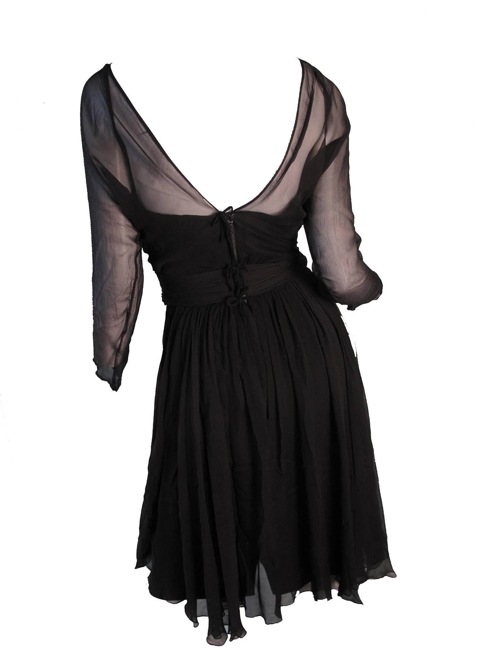 1950s black Bullocks Wilshire cocktail dress. Condition: Good.  Size Med ( mannequin is a US size 6)
We accept returns for refund, please see our terms.  We offer free ground shipping within the US. 