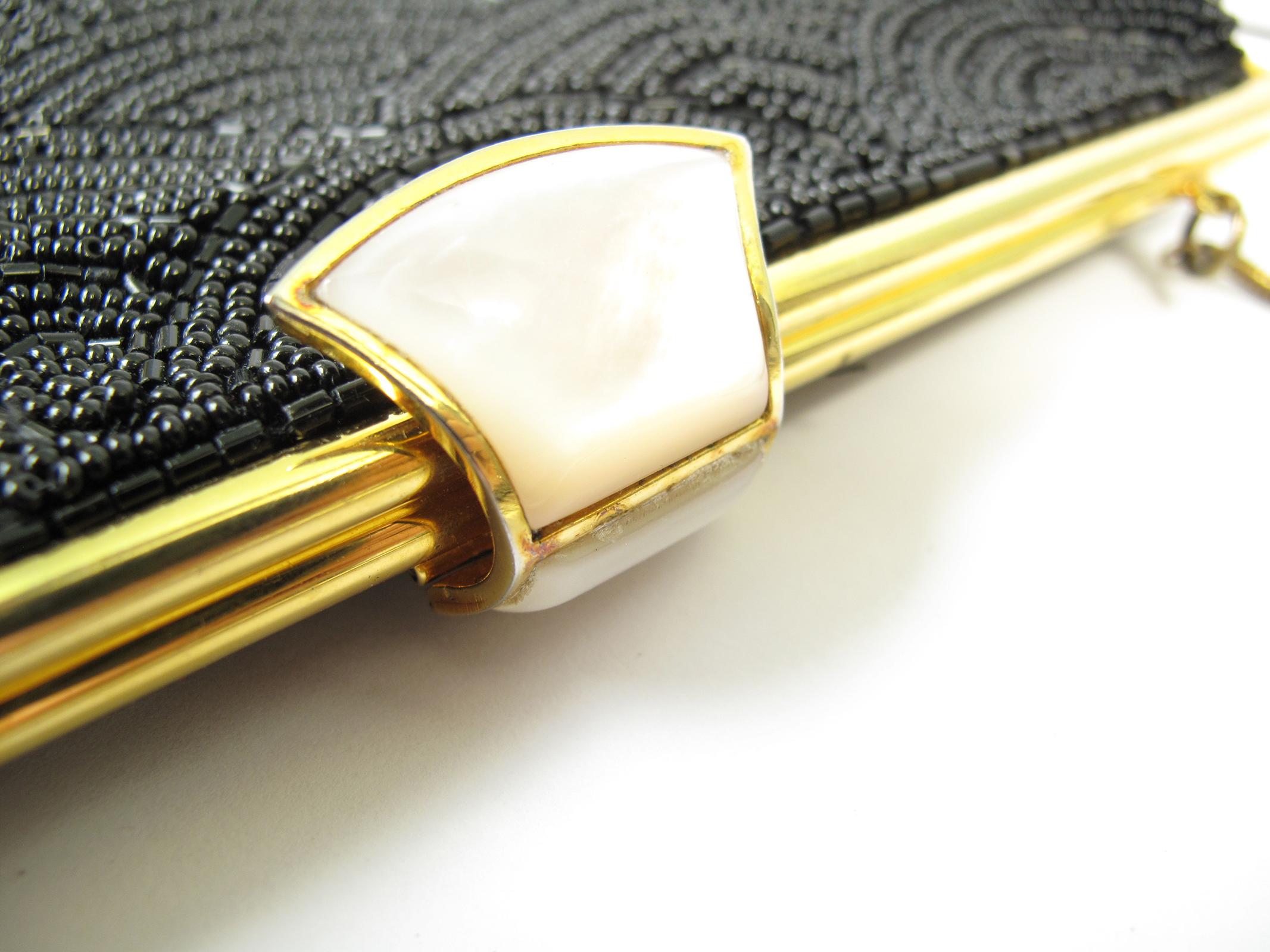 1958 Gucci bag beaded evening bag with snake chain and mother of pearl clasp.  Condition: Excellent. 

We accept returns for refund, please see our terms.  We offer free ground shipping within the US.