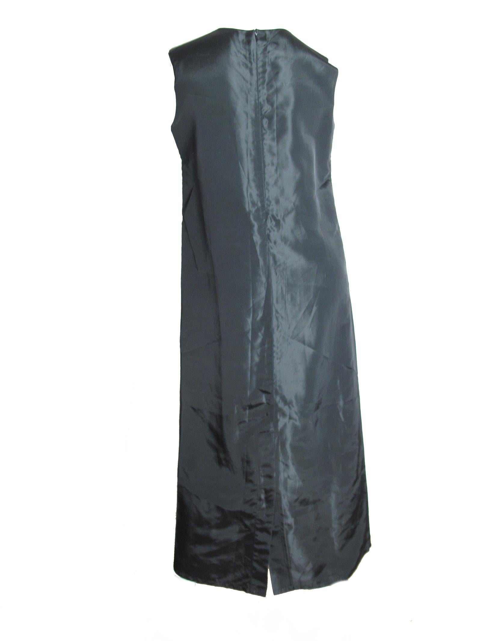 Yohji Yamamoto + Noir black acetate sleeveless dress circa 1990s.  Yohji Size 4 / US size 8 / 10 ( mannequin is a US size 6 ) 
We accept returns for refund, please see our terms.  We offer free ground shipping within the US.  Please let us know if