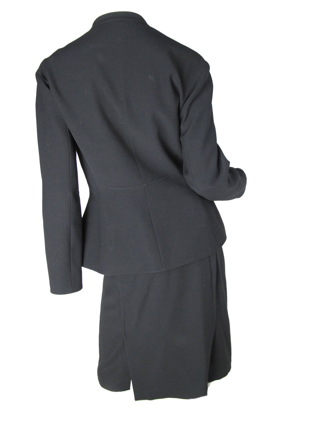 Thierry Mugler black wool suit.  Snaps to close jacket. Fitted waist. Two front pockets.  
Blazer: 37