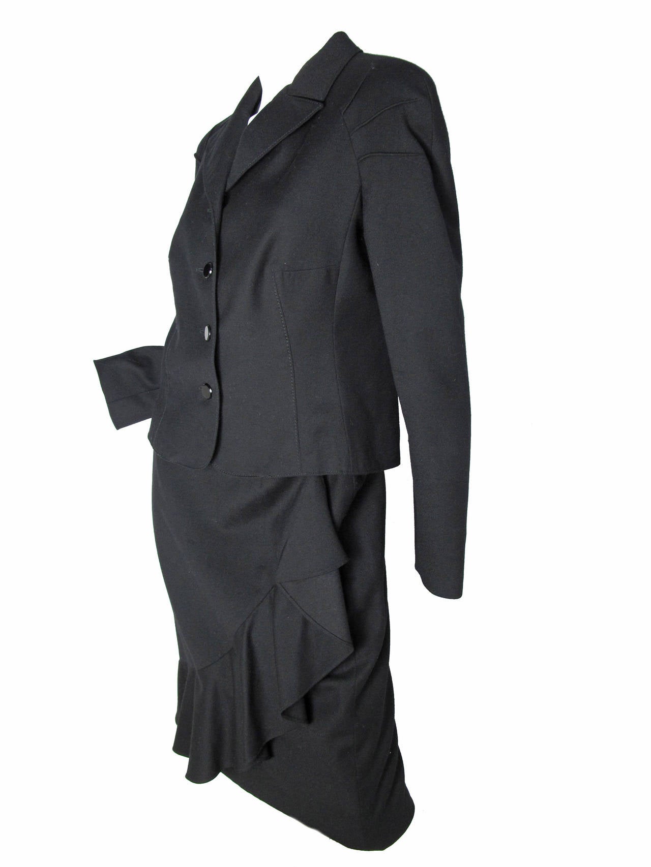 Valentino Boutique black wool suit with ruffle. Condition: Excellent. Size 14
Jacket: 38