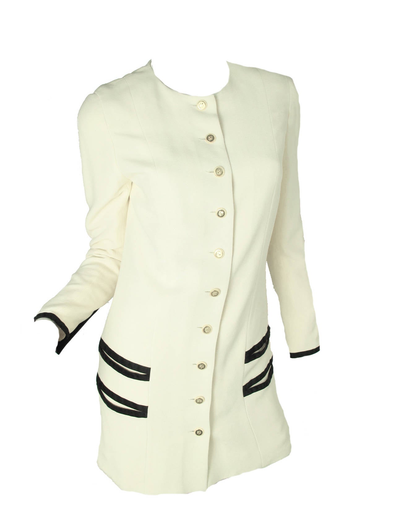 Chanel Silk long jacket and pleated skirt, clover buttons. Four front pockets on jacket.  Condition:  good, small spot on sleeve and black marker on inside lining at hem. Size 40

We accept returns for refund, please see our terms.  Free Ground