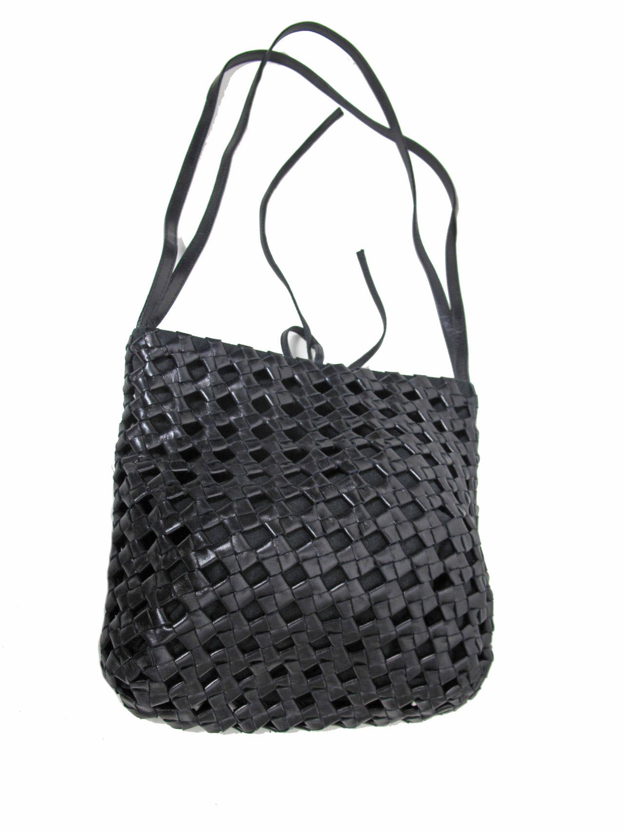 Bottega Veneta black woven leather bag.  Condition: Excellent, looks new - with dust bag.  Magnet snap and tie to close.  9 1/2