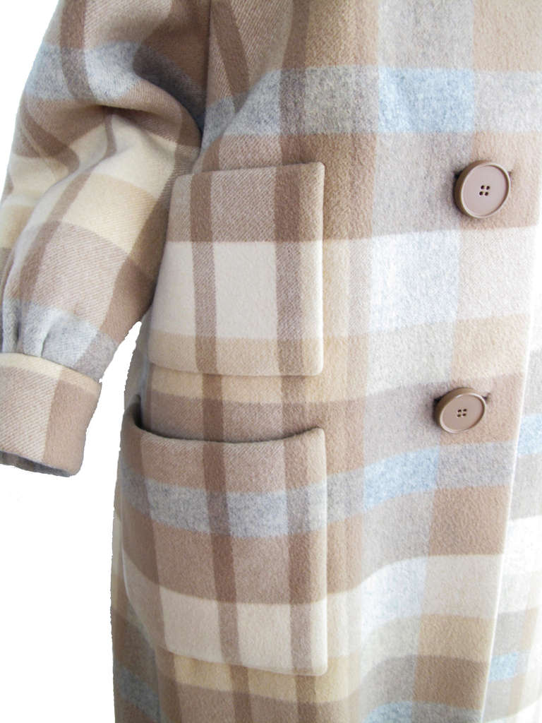 Norman Norell tan, blue, brown plaid wool coat.  Three front pockets.  44