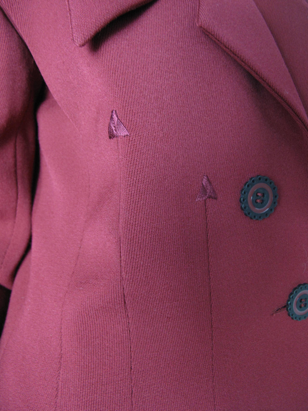 Karl Lagerfeld maroon wool gabardine suit with arrow stitching. Jacket: 42" bust, 34" waist, 23 1/2" sleeve, 40" hips, 17 1/2" shoulder, 29" length. Skirt: 28" waist, 36" hips, 28" length.  Condition: