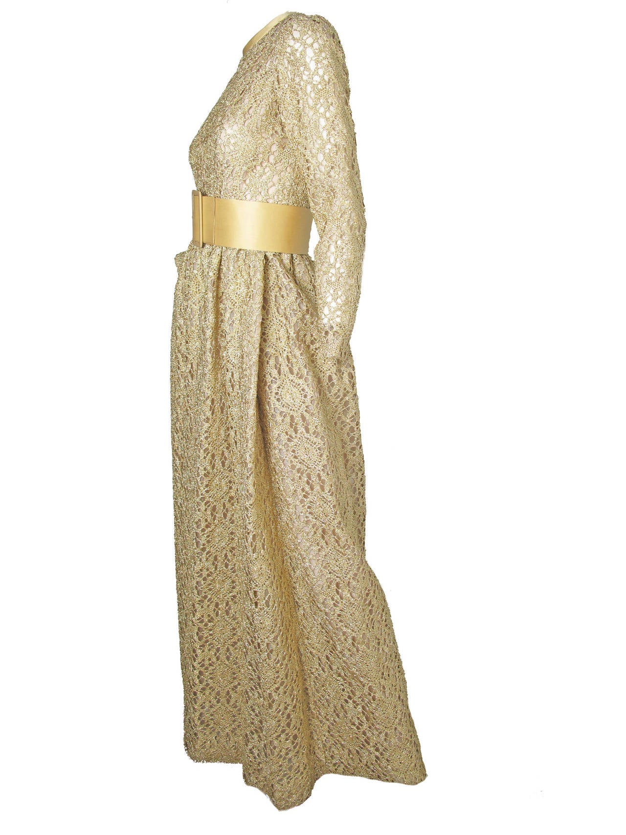 1960s Claudia by George Halley gold metallic lace gown with wide waist belt and pockets. Condition: Excellent. 

34